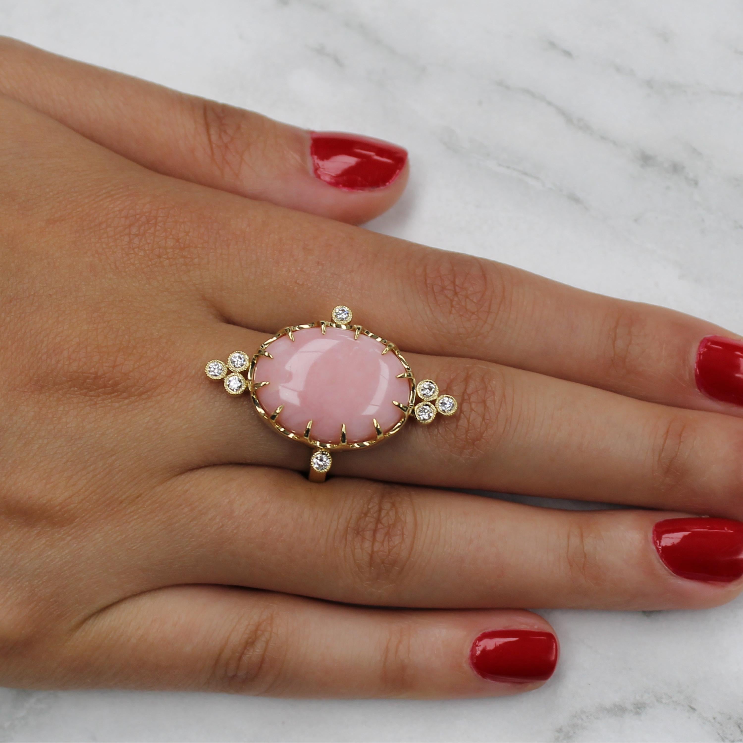Cabochon-cut Pink Opal ring, with bezel-set diamonds, set in 18K yellow gold. Finger size 6.5, adjustable upon request/quote. Pink Opal is a powerful stone, known for healing the emotions, especially those connected with subconsciously held pain,