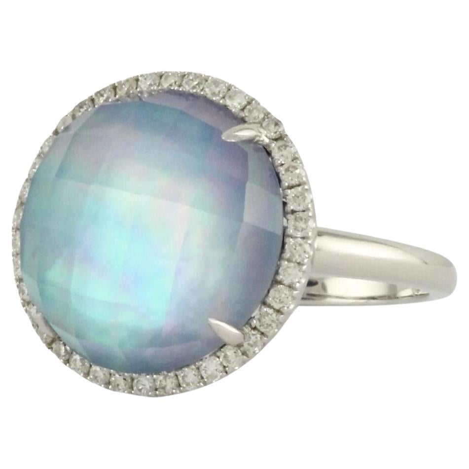 Doves Ivory Sky 18k White Gold Ring.  Lapis, white mother of pearl and white topaz combine for a vibrant grey-blue with rainbow hues. Surrounded by pave set round white diamonds. Ring contains thirty eight brilliants with total weight 0.30 ctw, and