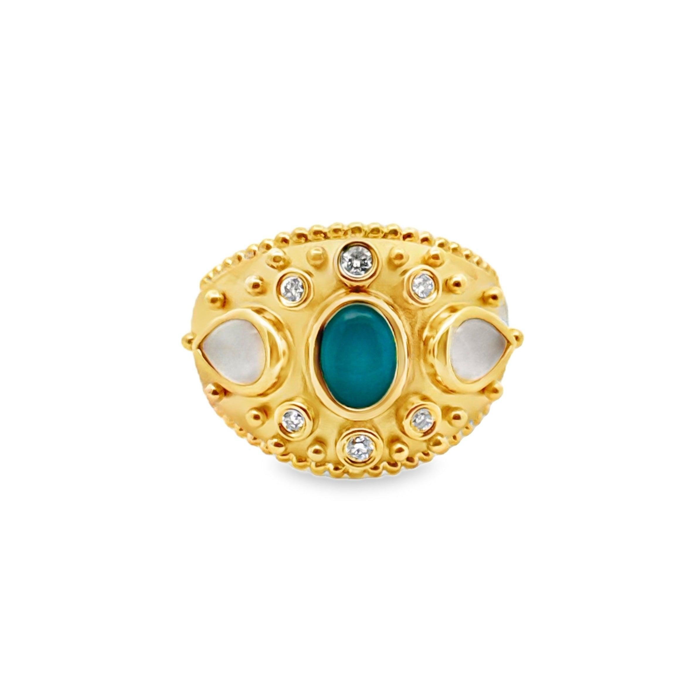 Manufactured by Doves. Main stone is turquoise with side opals and six diamonds.
18 karat yellow gold. 6 round diamonds, .11ctw. Two white mother of pearl sides, 1.54ctw and turquoise center, .97ctw.