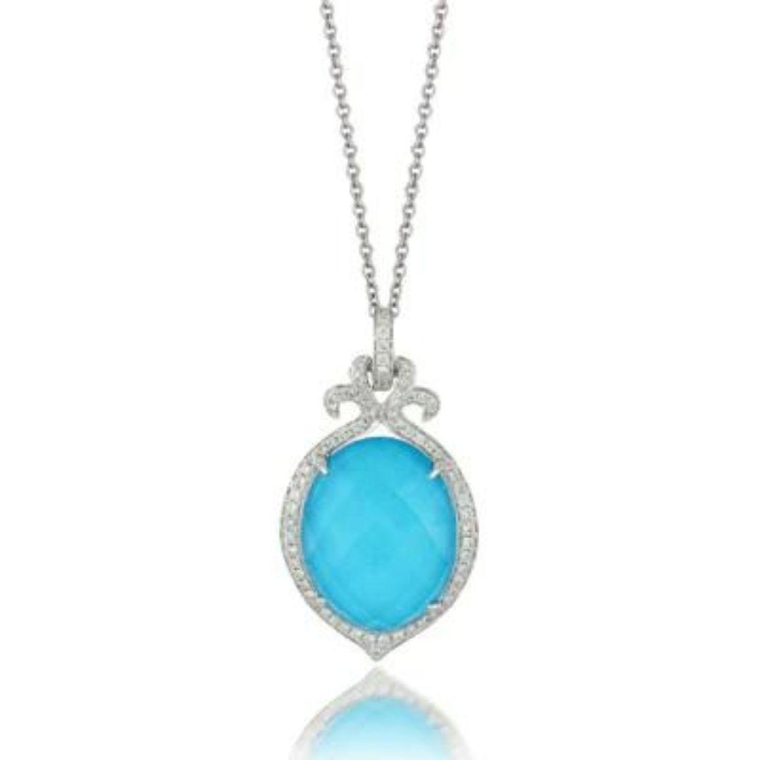 Doves Eighteen Carat White Gold Tourquose, Diamonds, and White Topaz Pendant. Inspired by the sparkling turquoise waters and crystal seas of the Caribbean. Natural Arizona turquoise is topped with clear white topaz. Pendant contains seventy four