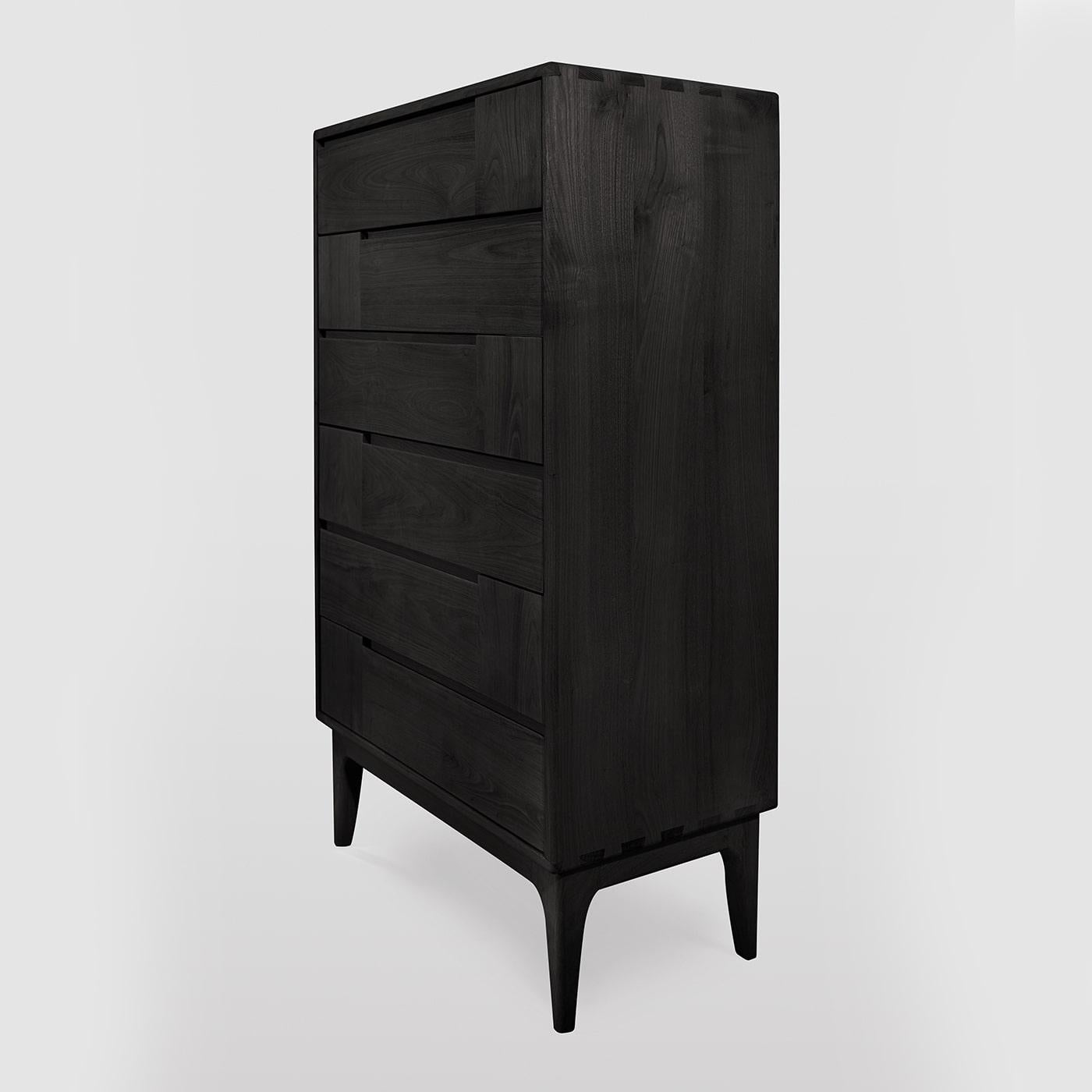 A total-black look of sophisticated charm, this Scandinavian-style dresser will make a stately addition to a contemporary interior. Handcrafted of colored solid chestnut, it features six drawers boasting horizontal and vertical lines, creating a
