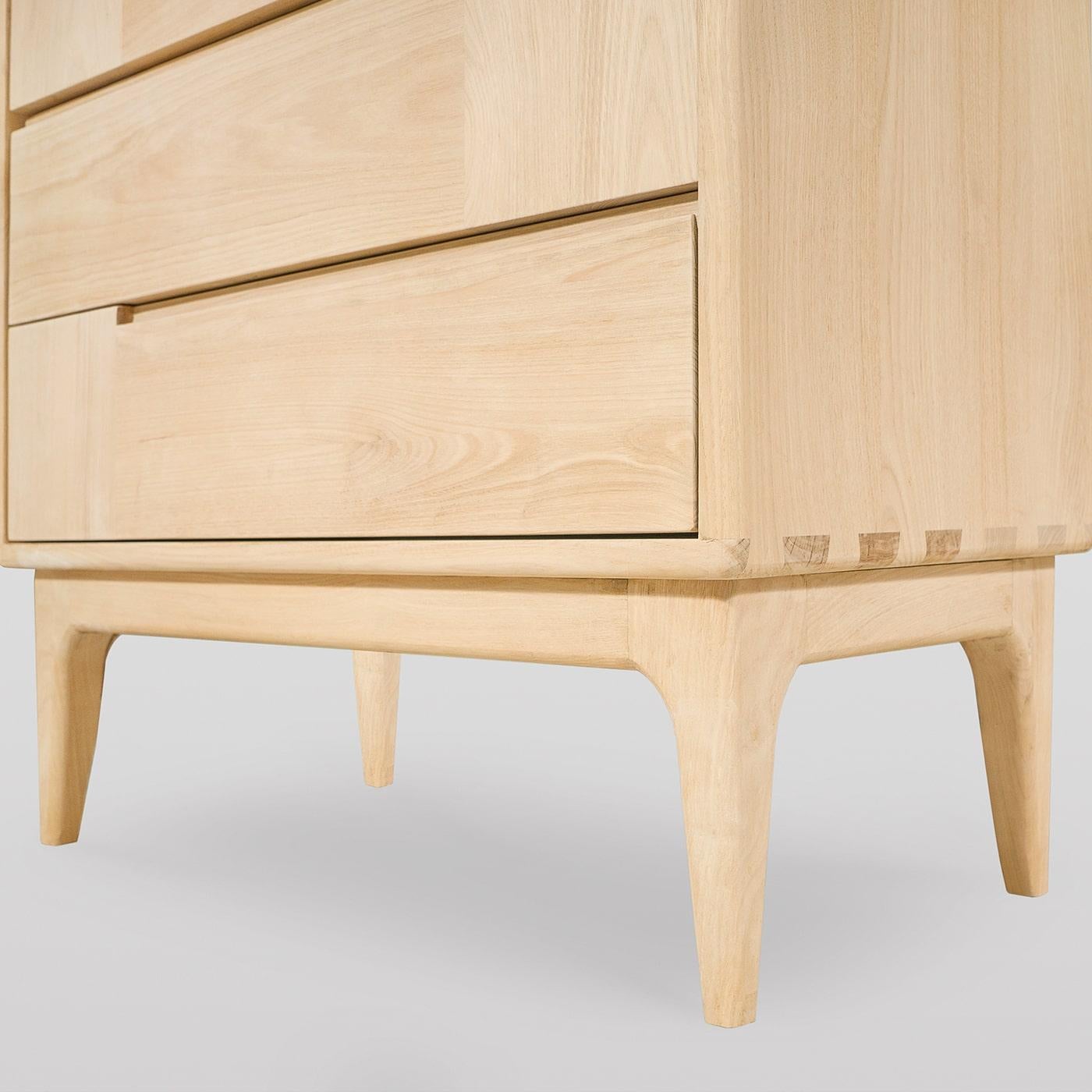 A clean and sophisticated design, this Scandinavian-style dresser will be a sleek accent piece for a contemporary interior space. Handcrafted of solid chestnut, it features six drawers boasting horizontal and vertical lines, creating a practical