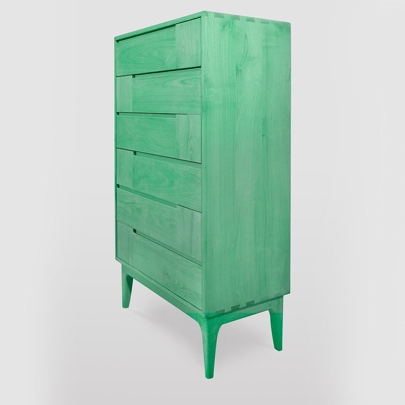 A singular design piece to complement a contemporary interior, this Scandinavian-style dresser will make a singular addition to a bedroom. Handcrafted of green-colored solid chestnut, it features six drawers boasting horizontal and vertical lines,