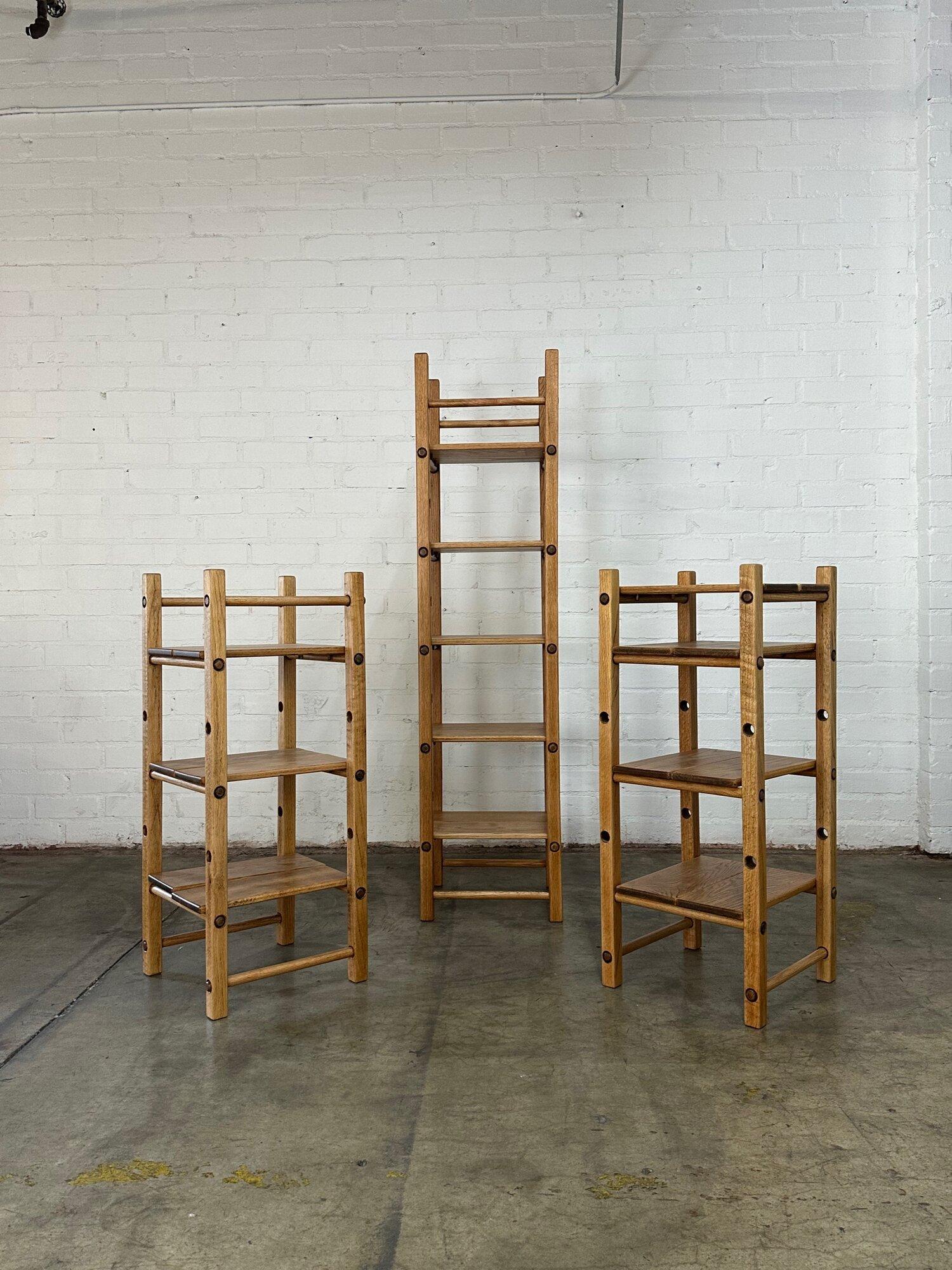 W17 D17 H42 BETWEEN SHELVES 11

Fully restored solid oak shelving unit. Shelving units consists of solid oak pieces that can be fully disassembled but come together tightly with dowel pressure. Shelving is fully removable. Listing is per matching