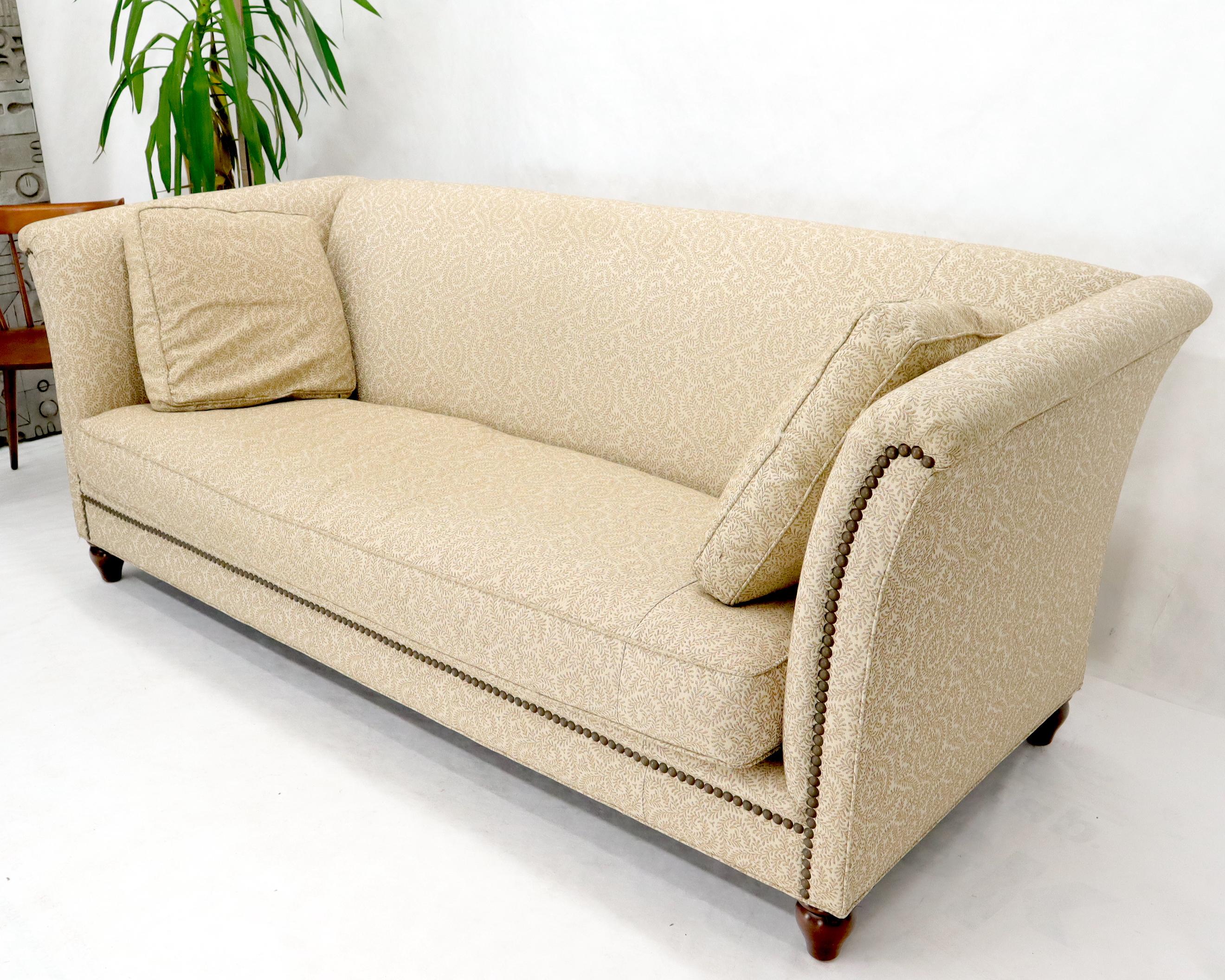 Vintage high arms down filled sofa. Very comfortable.