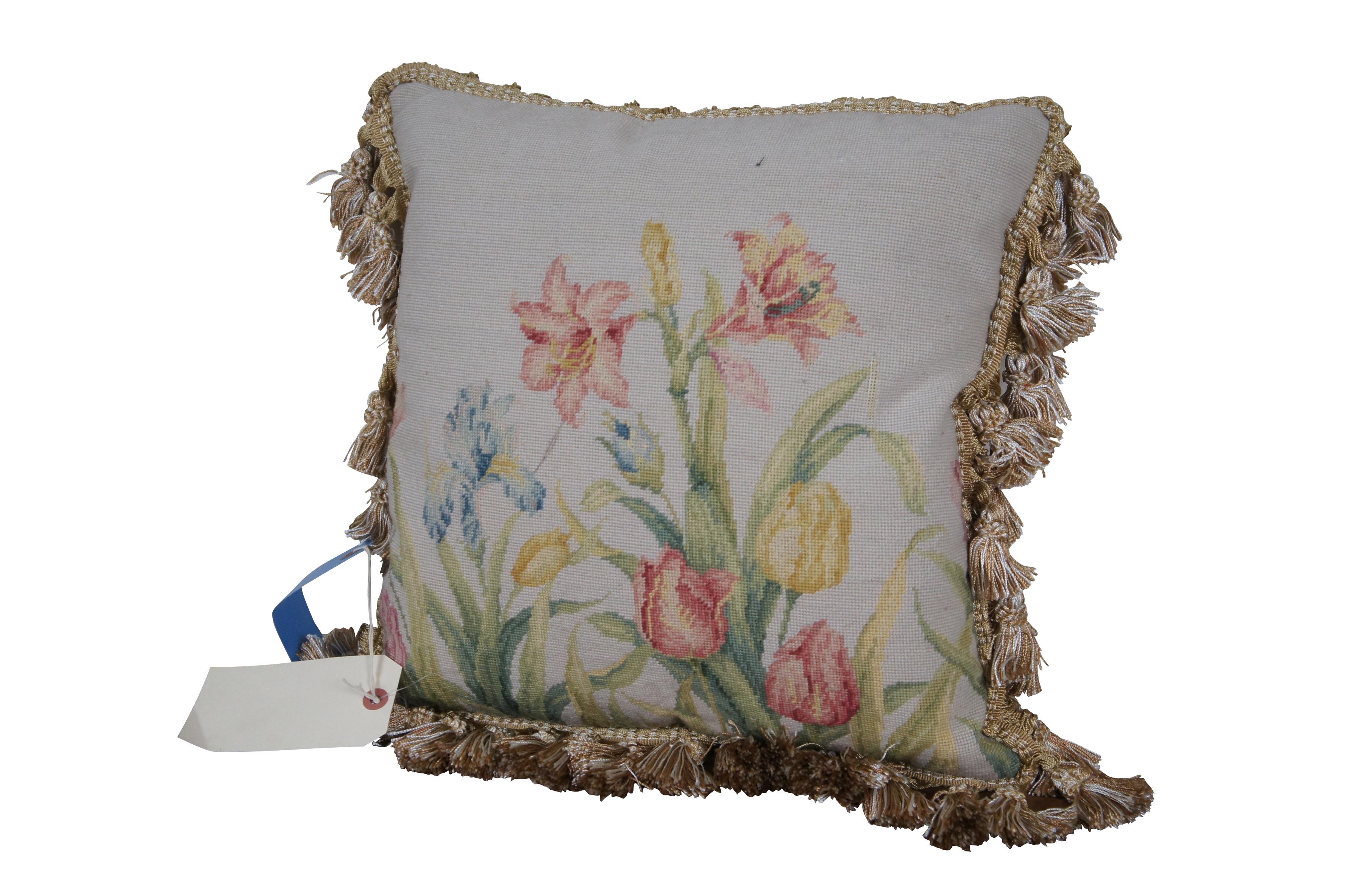 2 Available - 20th century square throw pillow, hand embroidered with a floral garden view of pink, yellow, and blue lilies, tulips, and irises. Beige and white tassel trim. Beige velour back with zipper closure. Down filled.

Dimensions:
16