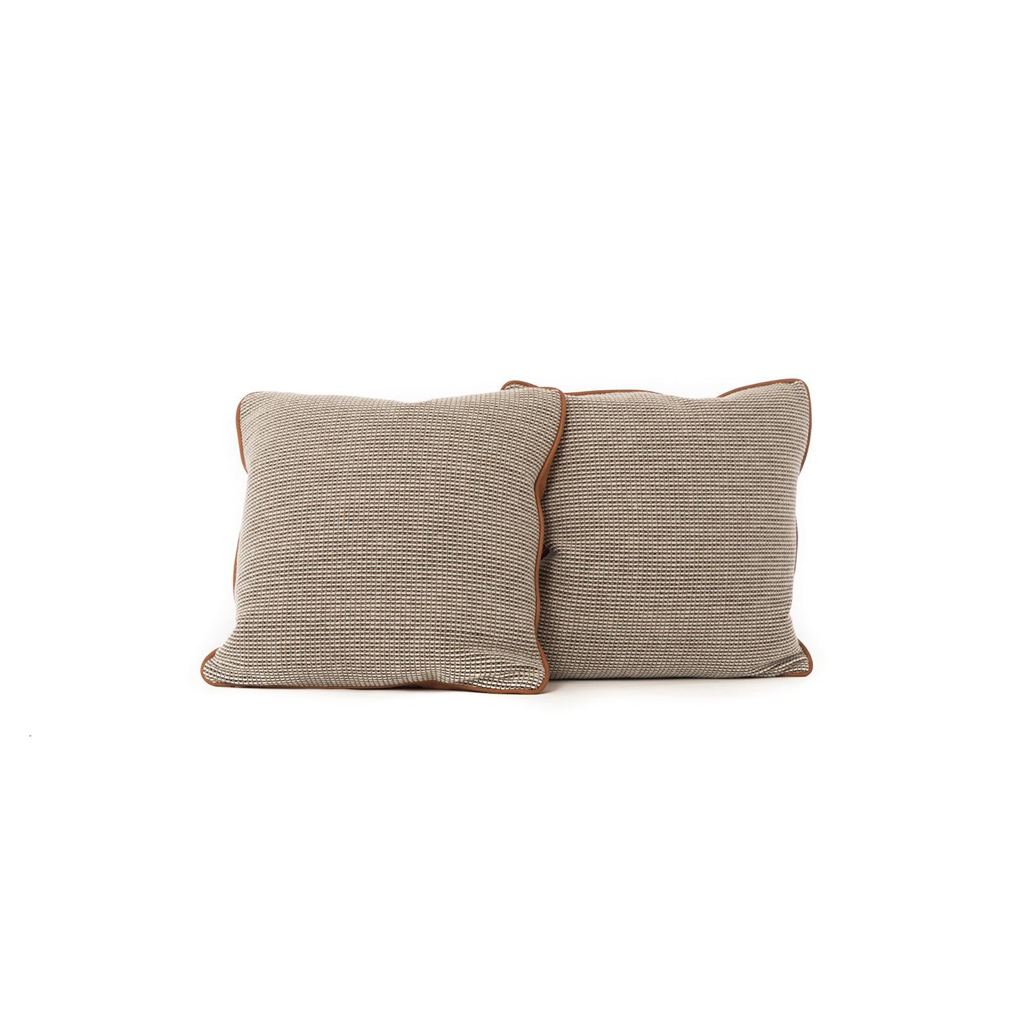 These positively cozy throw pillows are menswear inspired, with supple cognac leather backs and piping, complemented by woven wool fronts in Cato by Knoll, colorway Sand'. These pillows are new and the only of their kind.