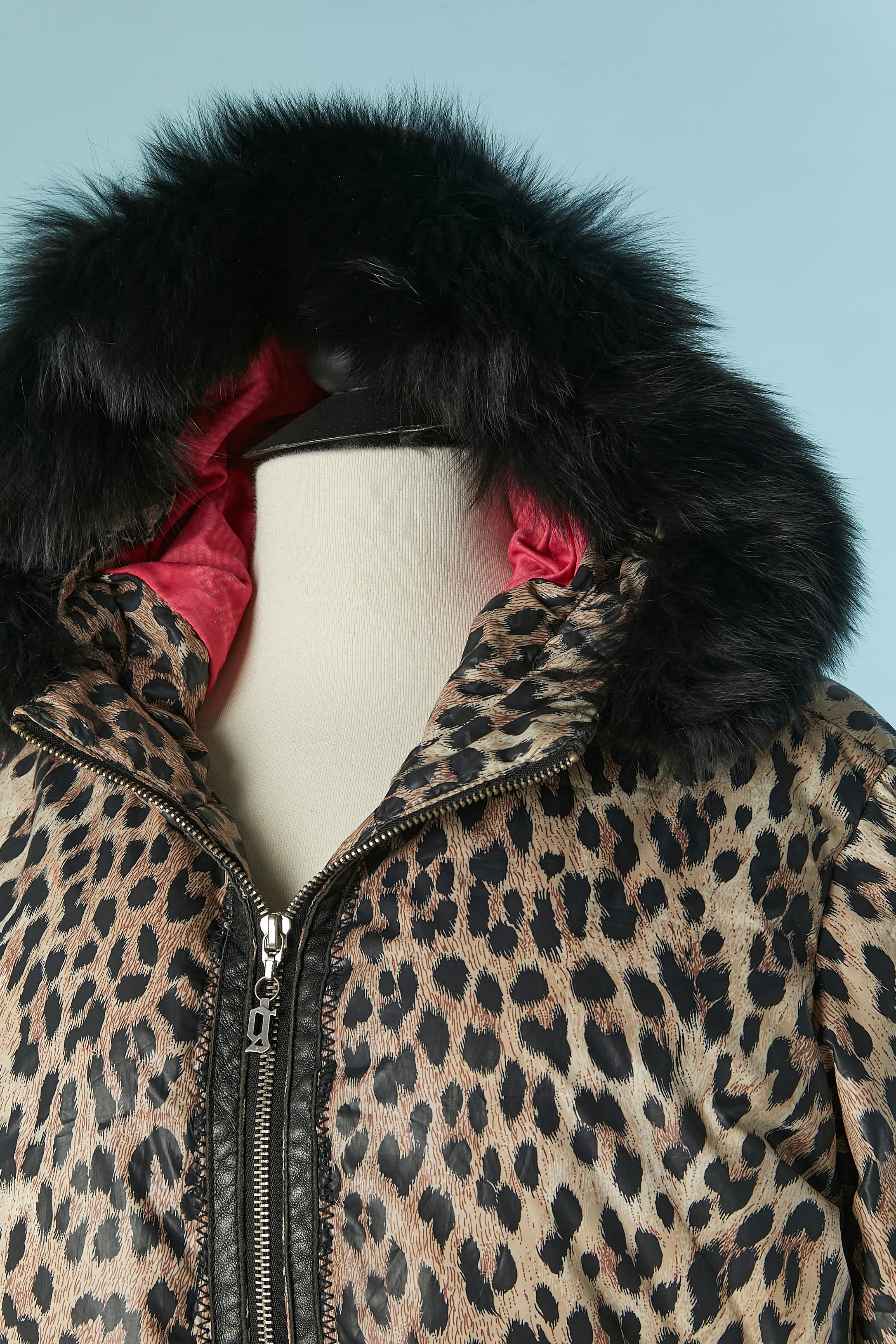 Down jacket with leopard print and hood with detachable fur edge. Main fabric composition and lining: 100% polyester. Padding: 80% down, 20% feather. 
Leather edge on the middle front and along the pocket. Drawstring around the hood. Zip closure on