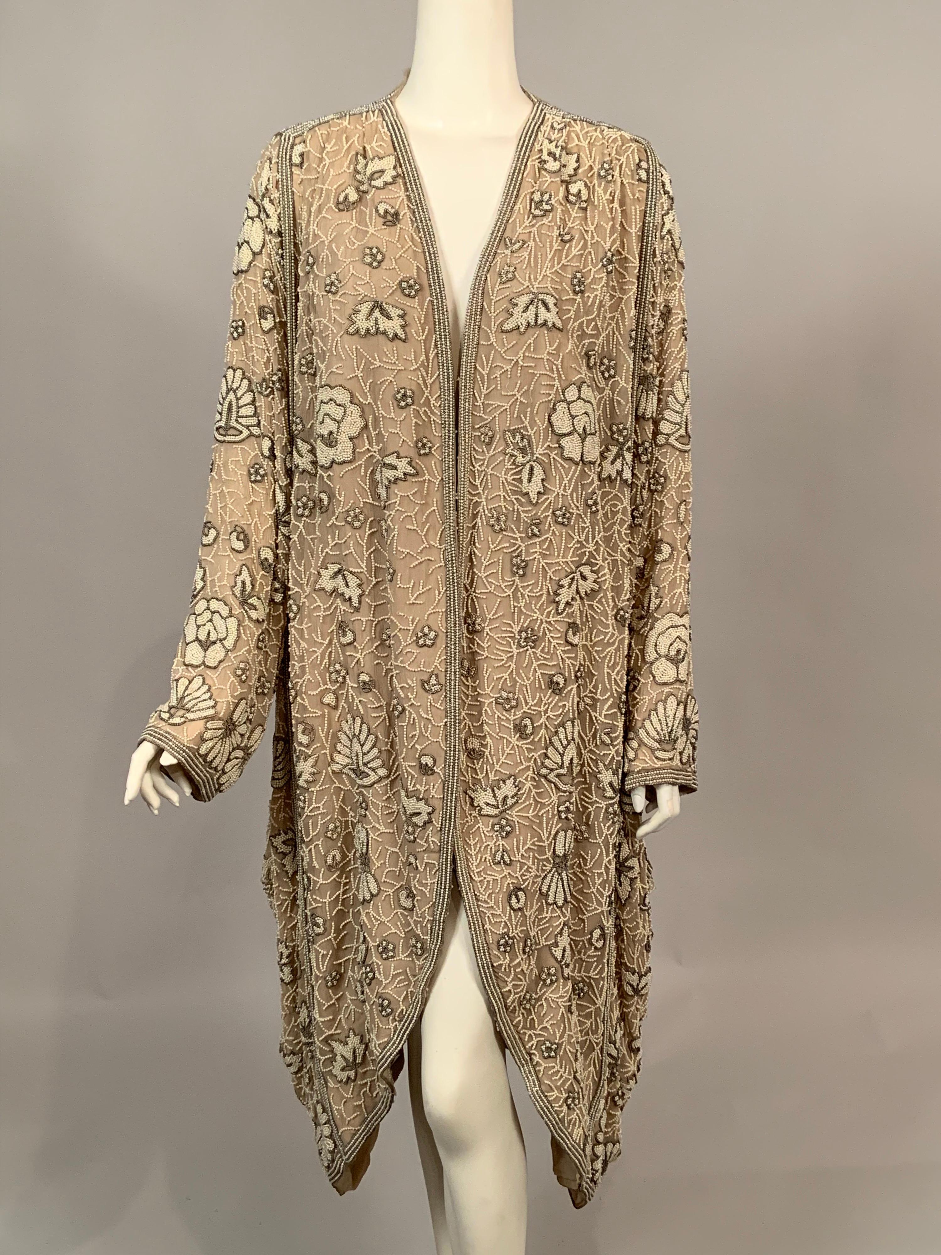 The wonderful shape and style of this chiffon coat is so evocative of the clothing worn by the elegant and affluent Crawley family in the PBS series and the movie Downton Abbey. The beige chiffon drapes beautifully on both sides, with layered beaded
