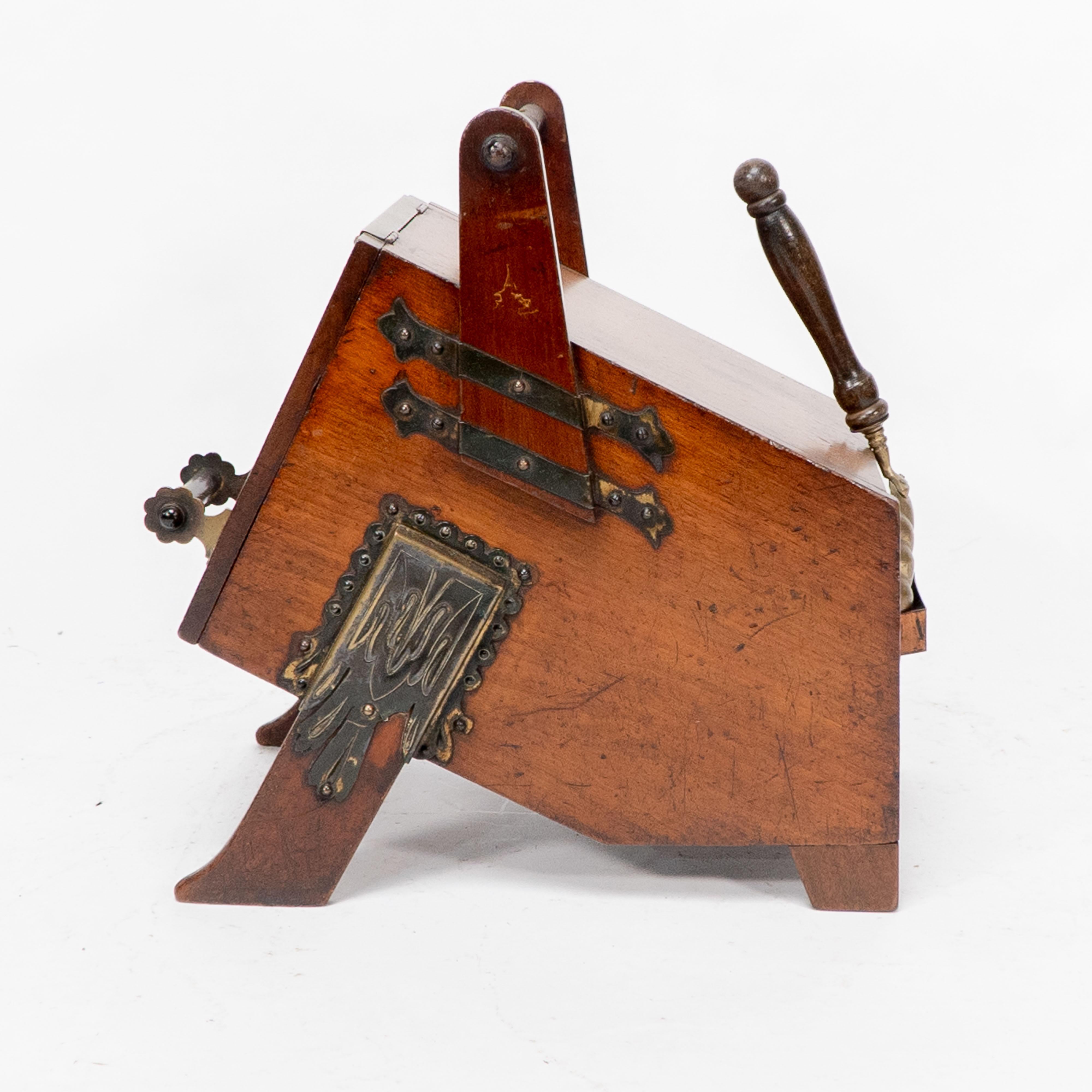 Late 19th Century Dr C Dresser. An Aesthetic Movement walnut coal box with stylized brass panels For Sale