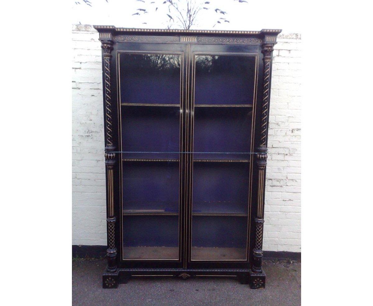 Dr C Dresser attributed an Aesthetic Movement ebonized display cabinet with incised and gilded zig-zag decoration.
Probably made for Bushloe House.
I was lucky enough to closely examine the Frog wardrobe, dressing table, chest of drawers and