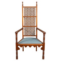 Dr C Dresser, attributed. A Moorish style walnut armchair