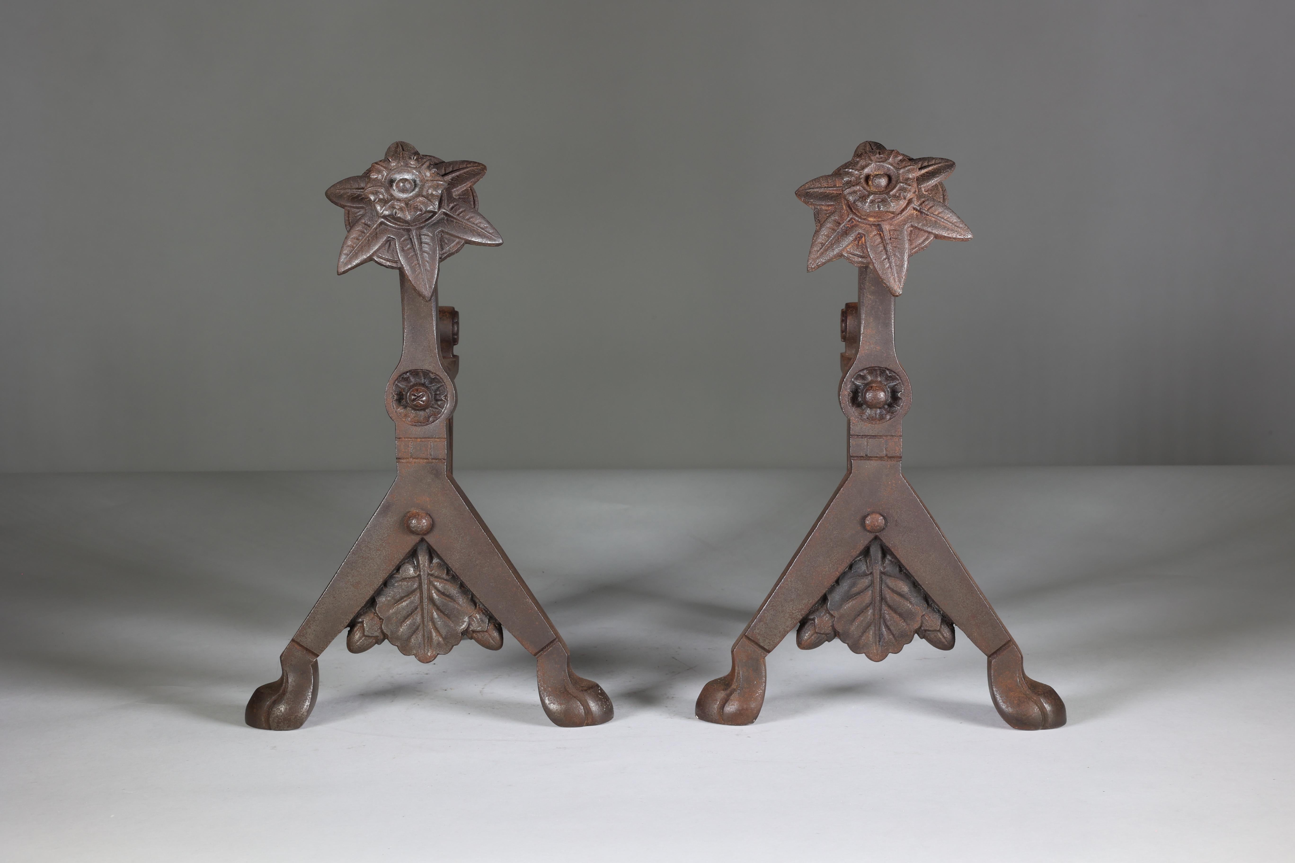 Dr. Christopher Dresser attributed. A pair of cast iron fire dogs, with registration design diamond, 1876.