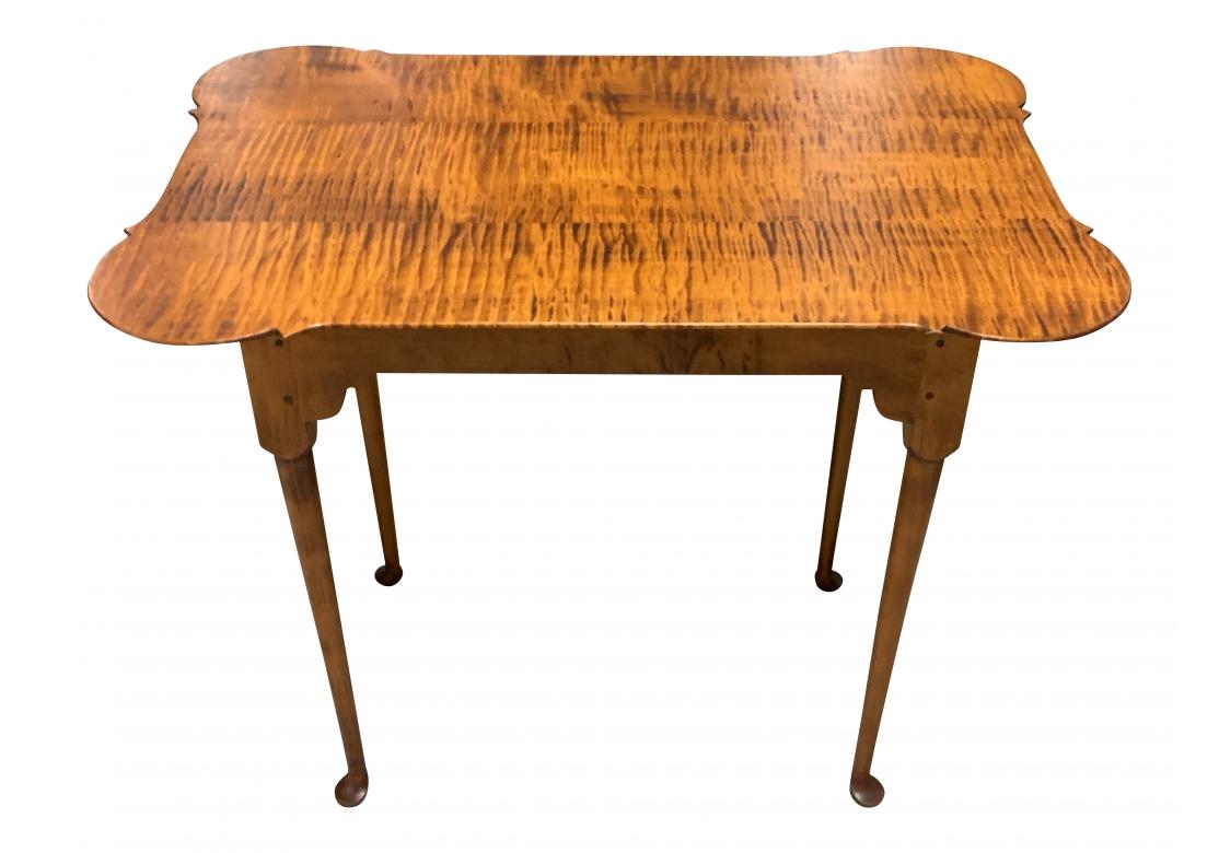 D.R. Dimes Tiger Maple porringer tea table standing proudly on dainty cantered Queen Anne style legs with classic pad form feet.

Dimensions: 22 1/4