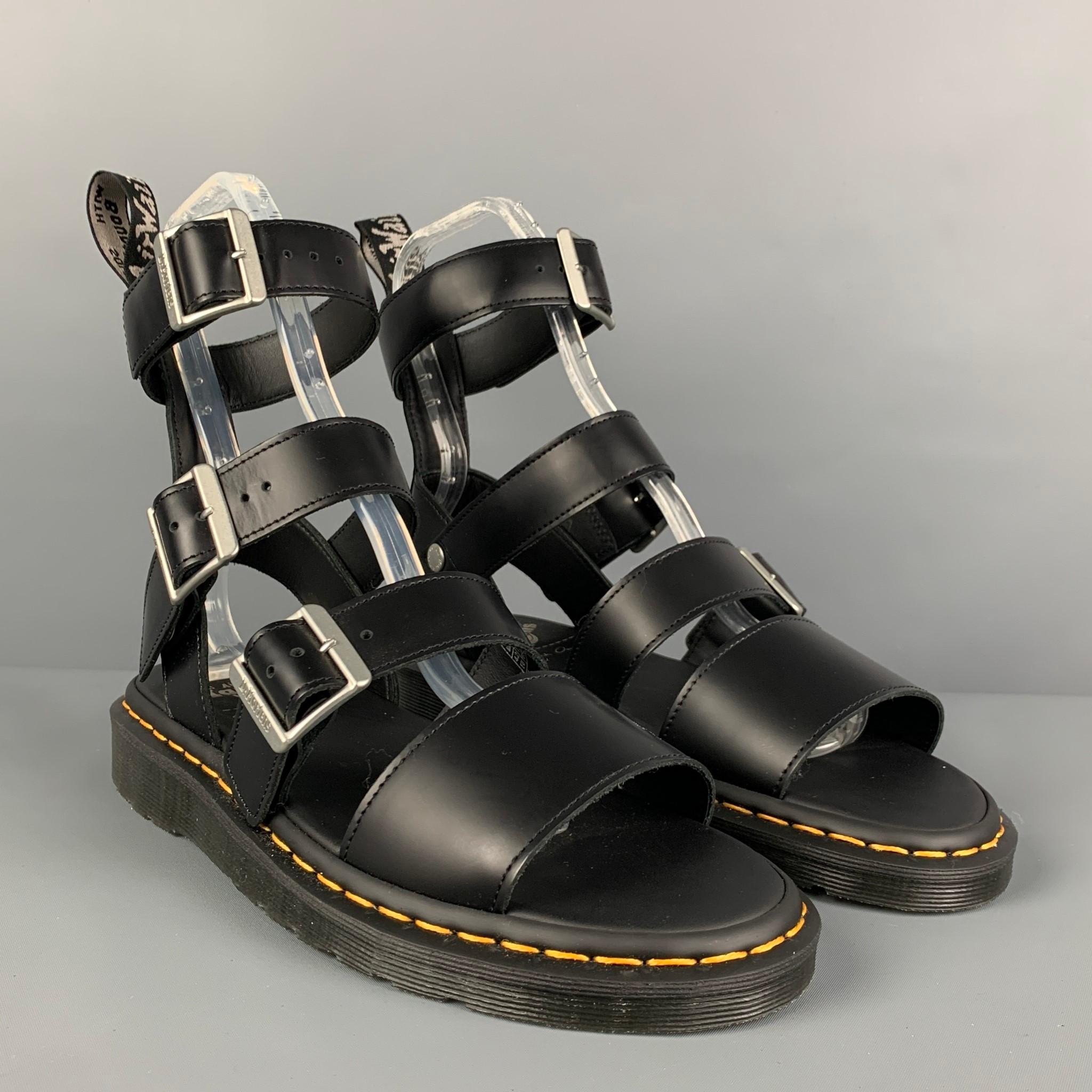 DR.MARTENS x RICK OWENS 'GRYPHON' sandals comes in a black leather featuring a gladiator style, contrast stitching, and a buckle closure. 

New Without Tags.
Marked: 9
Original Retail Price: $392.00

Outsole: 11.25 in. x 4.5 in. 