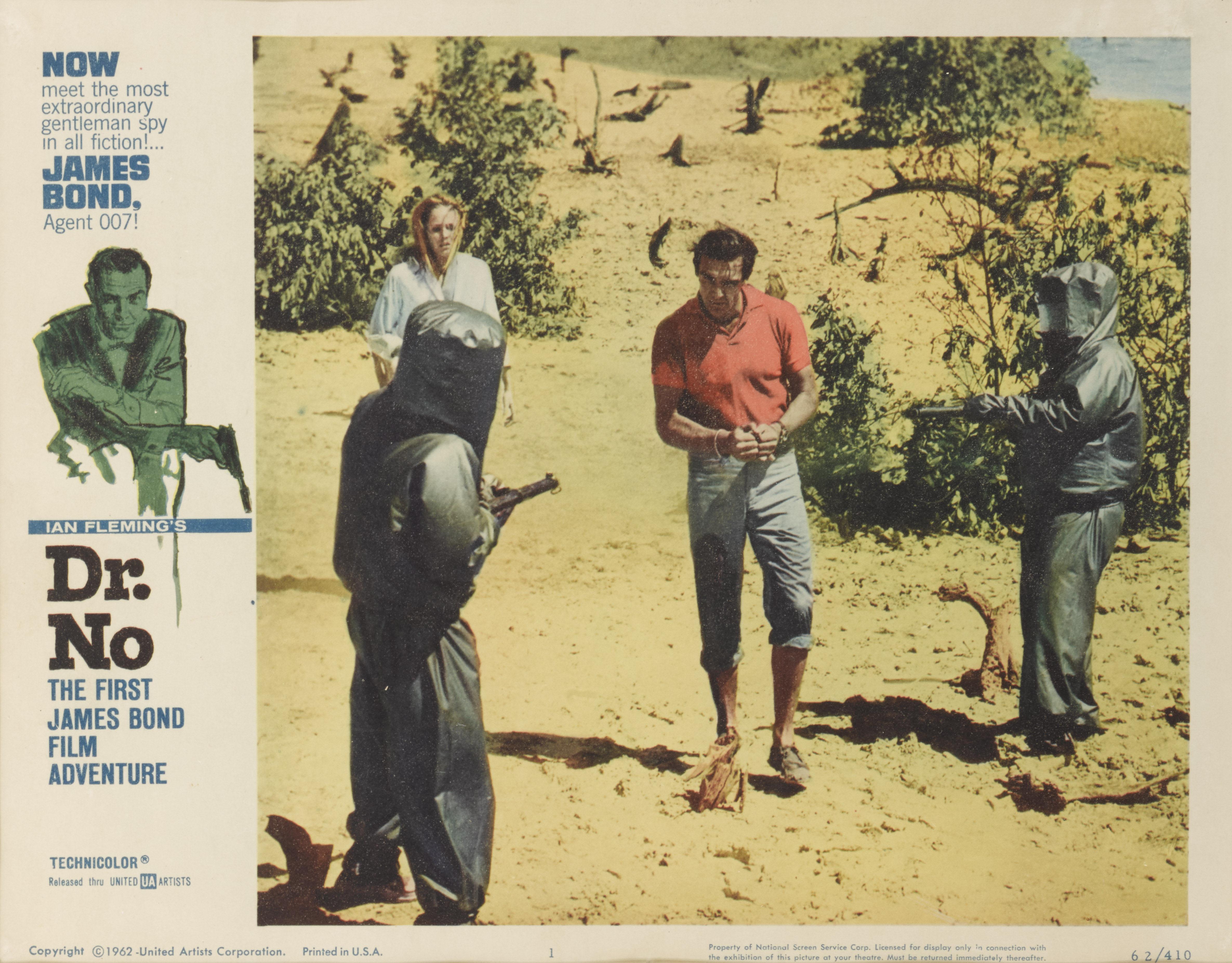 Original US-Lobbykarte für den ersten James-Bond-Film Dr. No (1962) mit Sean Connery und Ursula Andress in den Hauptrollen. Der Film wurde unter der Regie von Terence Young gedreht.
 Die Lobby-Karte ist Erhaltung mit UV-Plexiglas in einem Tulip