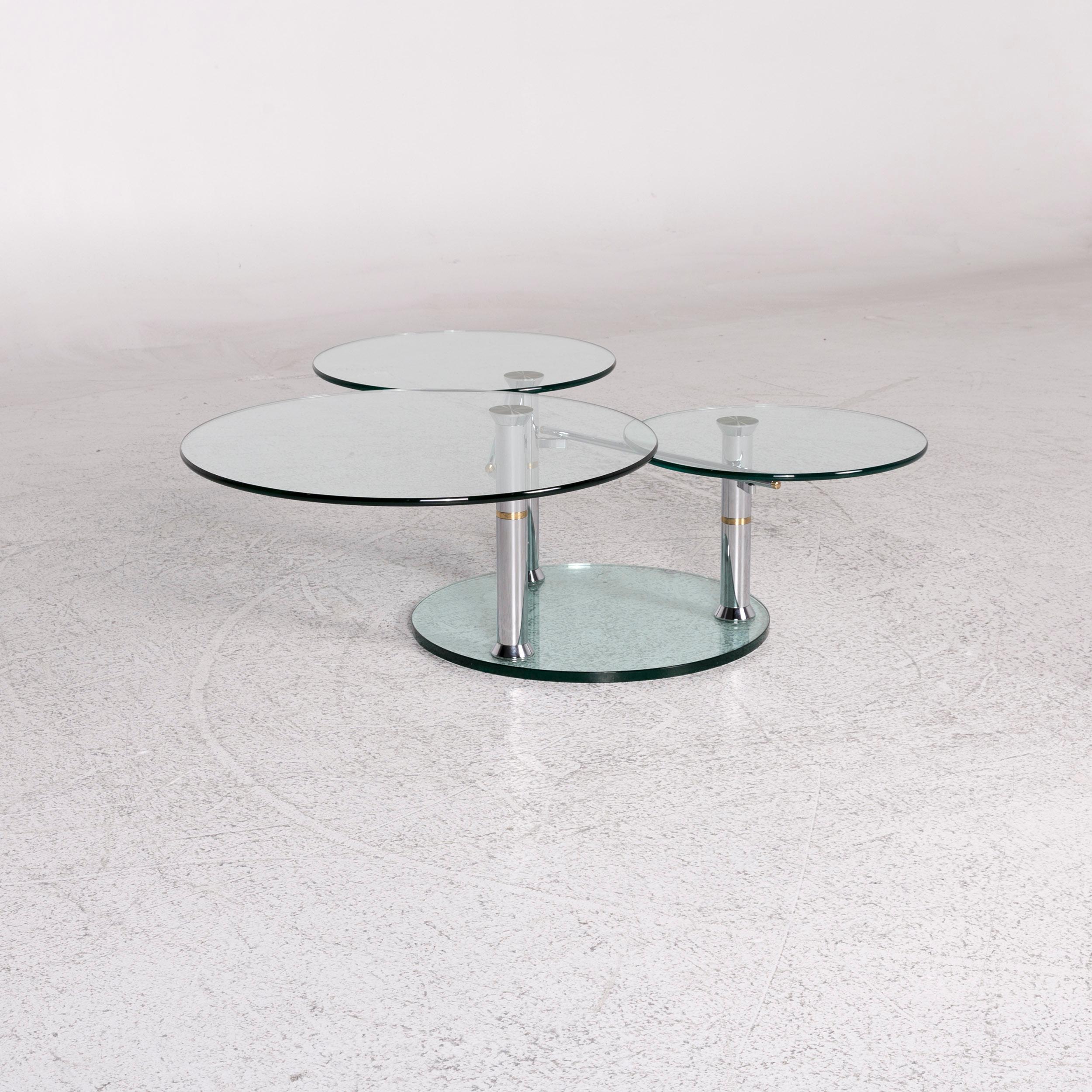 We bring to you a Draenert Intermezzo glass coffee table silver rotary function.

 Product measurements in centimeters:
 
 Depth: 110
 Width: 83
 Height: 43.





 