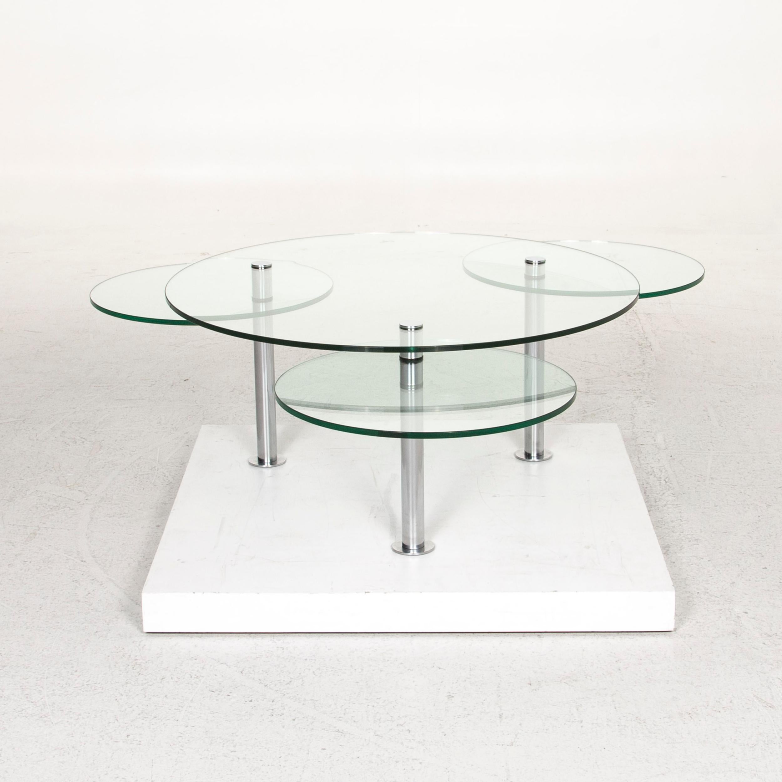 We bring to you a Draenert Intermezzo glass coffee table silver variable function table.

 

 Product Measurements in centimeters:
 

 Depth 99
 Width 99
 Height 45.




 