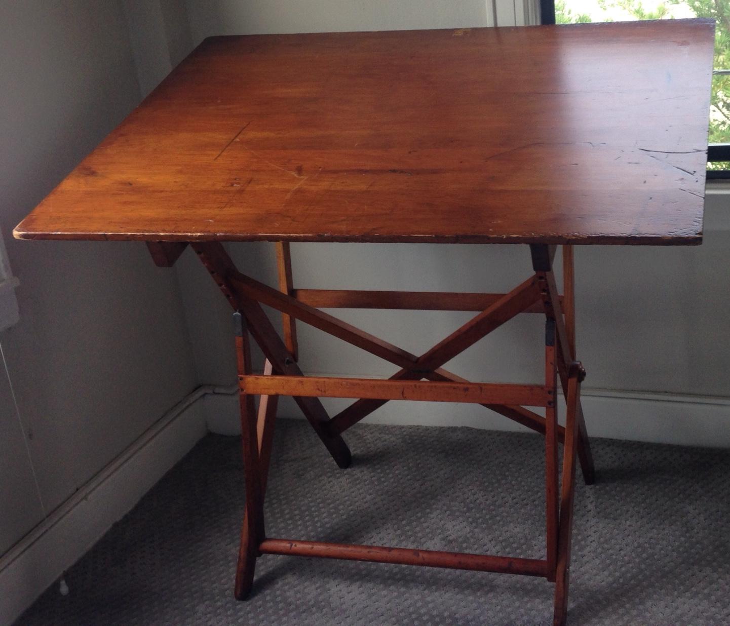 Drafting table by Keuffel Esser, circa 1900s. Made from Southern Plantation Pine, the oversized top has acquired a beautiful patina over years of work in an architect's office. Adjusts from a flat surface to a 135 degree angle. The adjustment is by