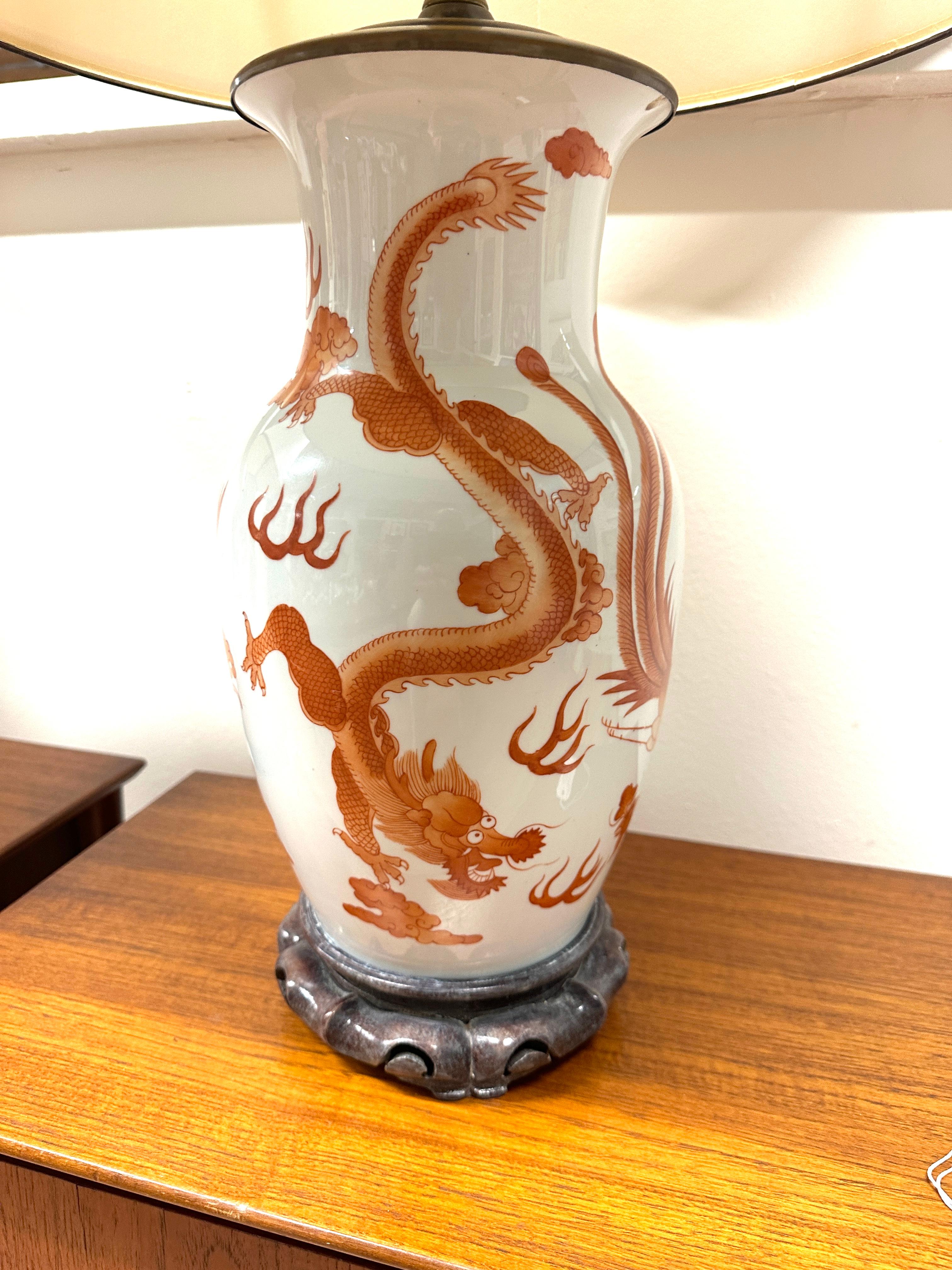 A lovely pair of Dragon and Phoenix hand painted Porcelain Chinese lamps with custom matching shades out of a local Palm Springs Estate. The vases alone measure 7.5 inches in diameter and 15 inches tall. Overall height of the lamps is 30.5 inches to