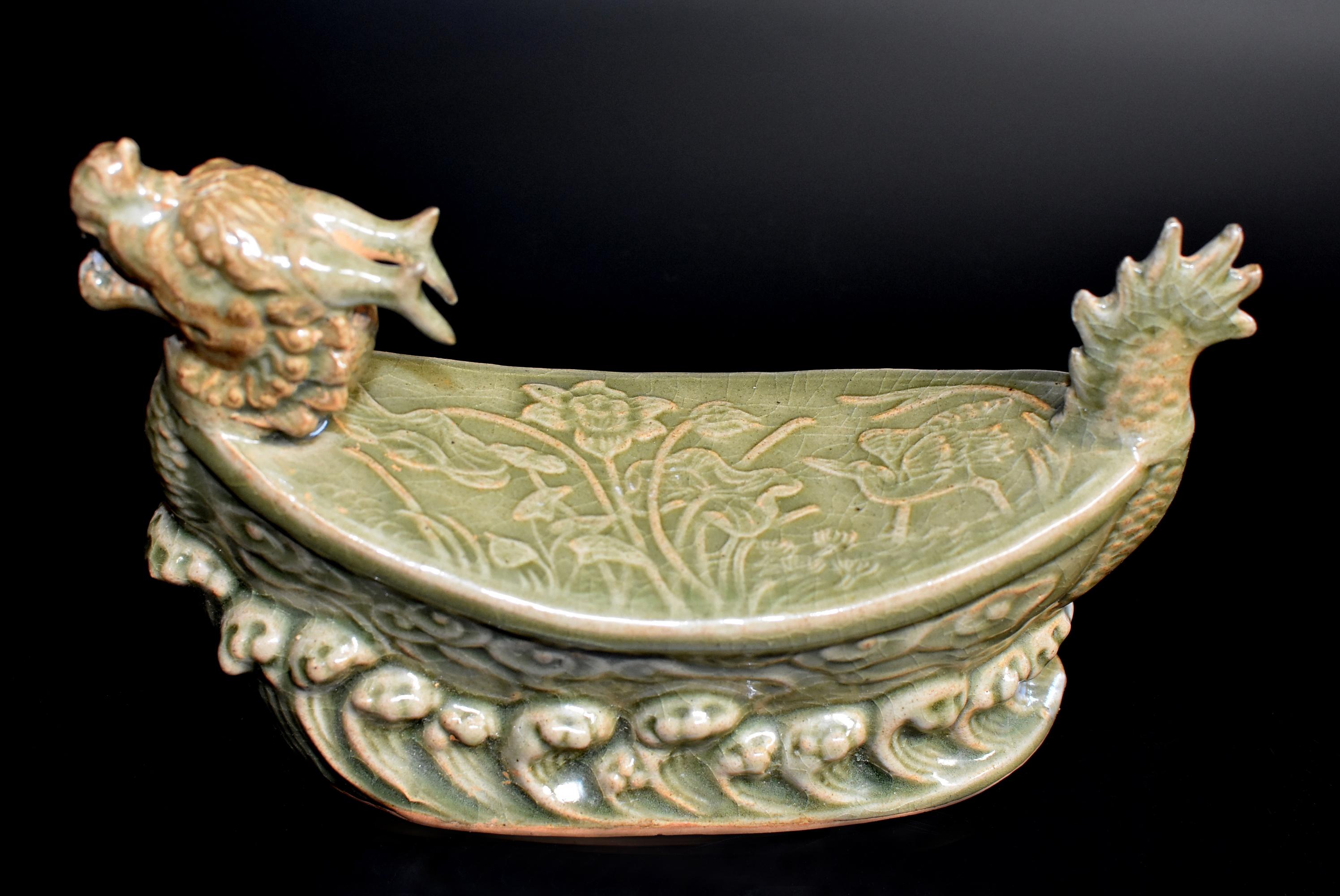 A song dynasty style porcelain pillow of the Long Quan kiln. The long Quan kiln is one of the most important song dynasty kilns. Started 1600 years ago, it produces celadon green and lotus leaf green glazed pieces with subtle under-glaze engraving.