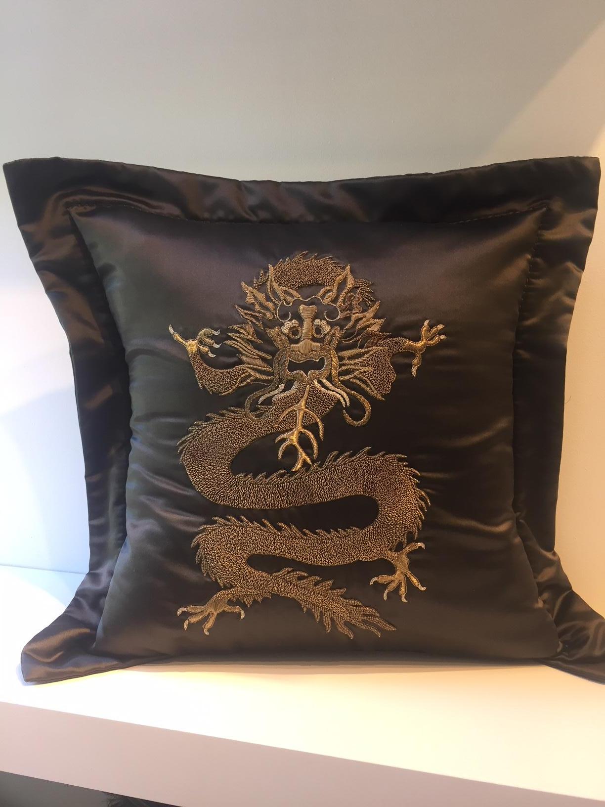 The Cushion made from silk satin from Italy  in col. bronze brown with Dragon Design  in Chinoiserie Style with delicate  hand embroidery using gold thread in different shades.
The cushion cover has as finish a border 