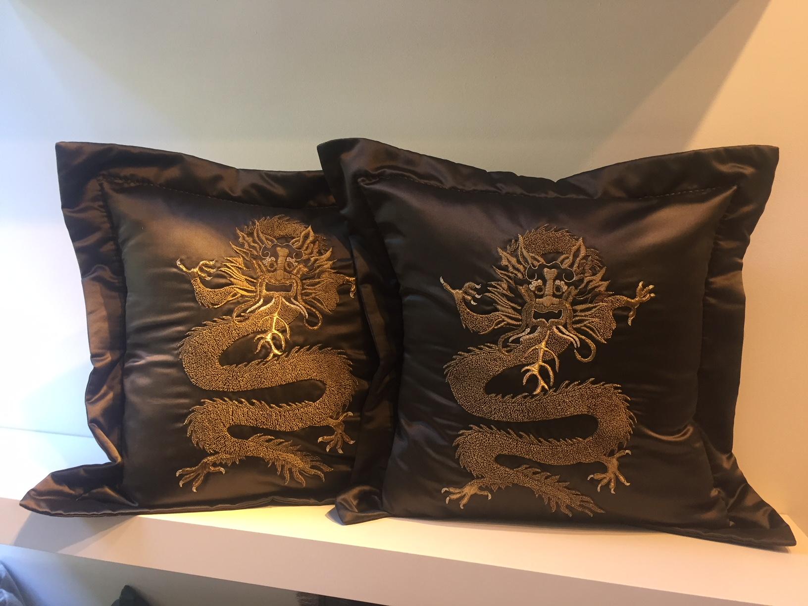 Cushion silk satin col. brown with dragon design hand embroidery with gold thread in different shades, the cushion cover has as finish a border 
