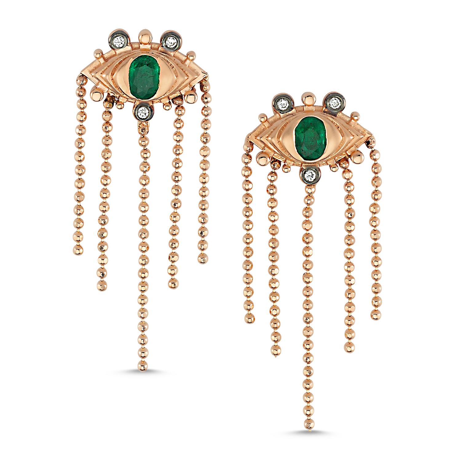 Dragon eye emerald chain earrings with 14k rose gold by Selda Jewellery

Additional Information:-
Collection: Dragon Lady Collection
14k Rose gold
0.04ct White diamond
0.3ct Emerald
Length 3cm