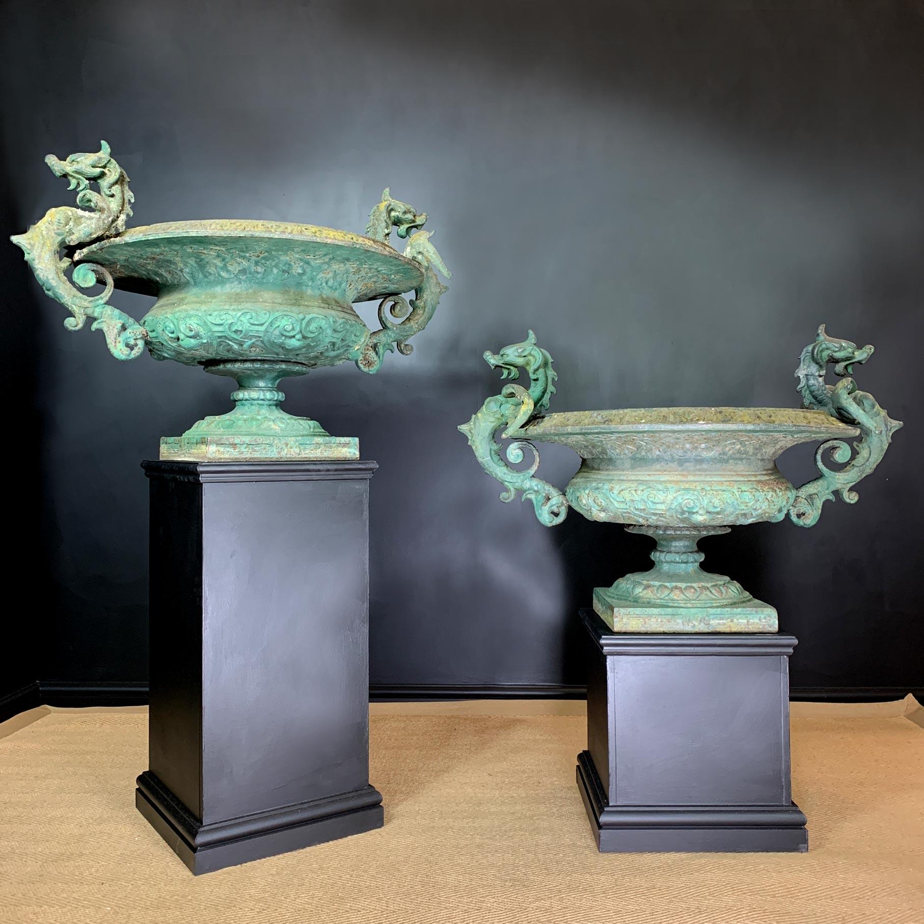 Finely cast pair of Dragon handled French cast iron Tazza Urns.

Dating to circa 1860, France.

Exceptionally well cast heavy iron urns, dragons adorn either side, each with wings outstretched and bearing breastplate armour. Attributed to the Val