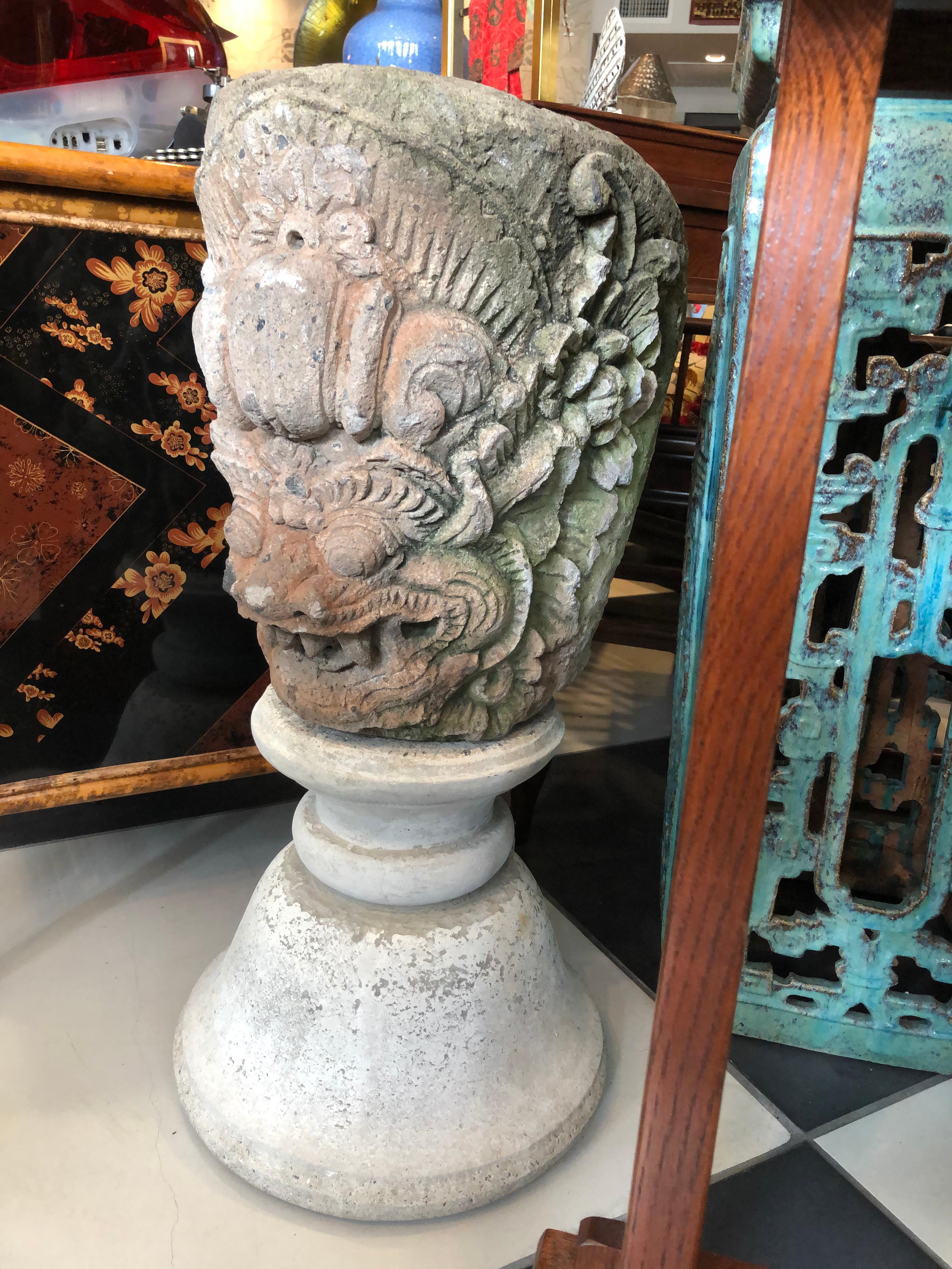 This Dragon Head planter is very interesting having being made of stone and opening at the top maybe for a fern? A residue of pinkish red to the face from Thailand.

  