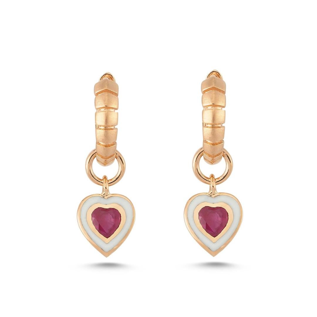 Dragon heart earring (single) with ruby and white enamel by Selda Jewellery

Additional Information:-
Collection: Dragon Lady Collection
14k Rose gold
0.28ct Ruby
White enamel