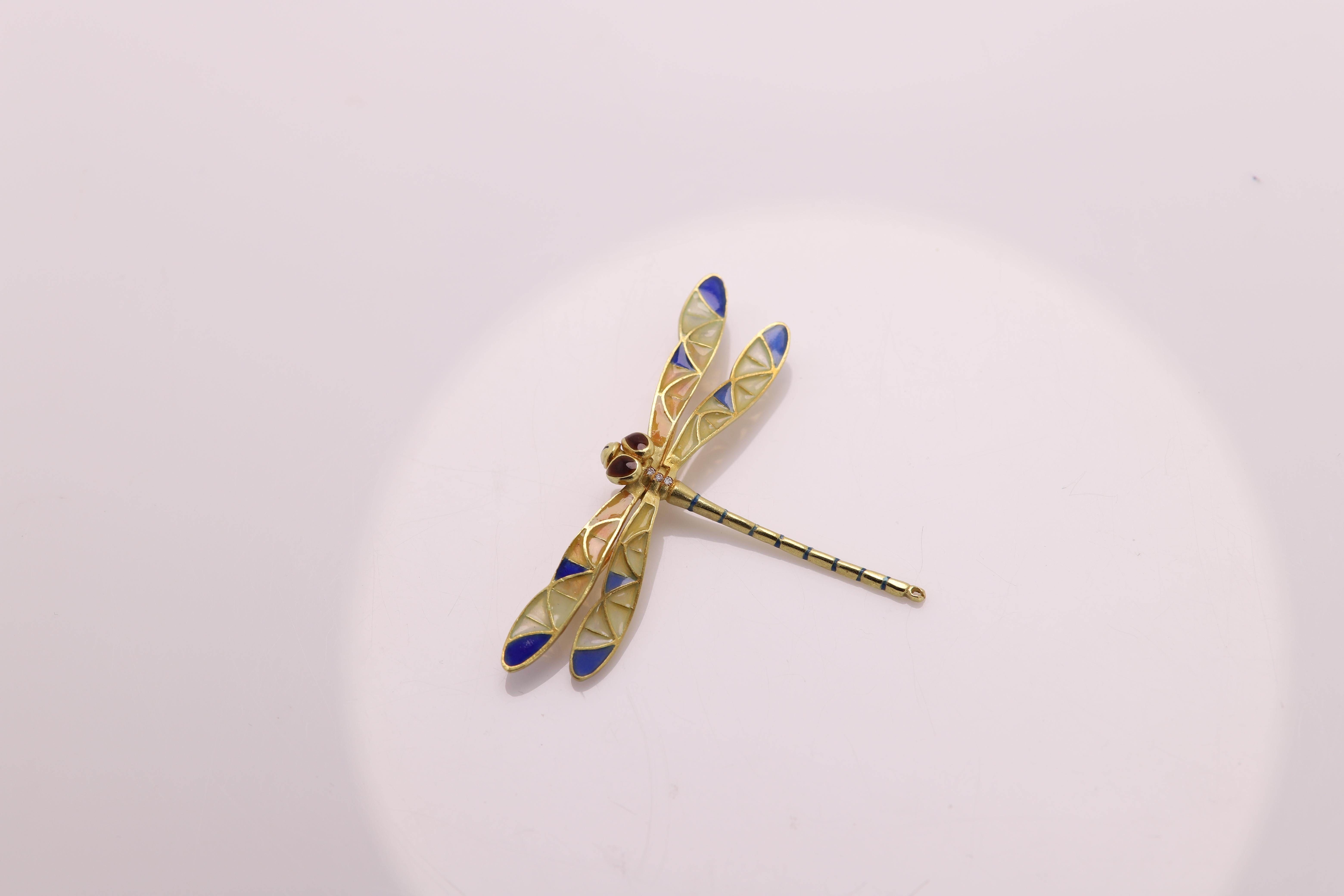VINTAGE DRAGONFLY BROOCH PIN / NECKLACE
Hand made in Spain with brilliant colors of Enamel
18K Yellow Gold
Total weight 7 grams
Has three small diamonds
Dimension: 2.25' inch wide
Can be used for a brooch or Pendant (chain not included)
was made