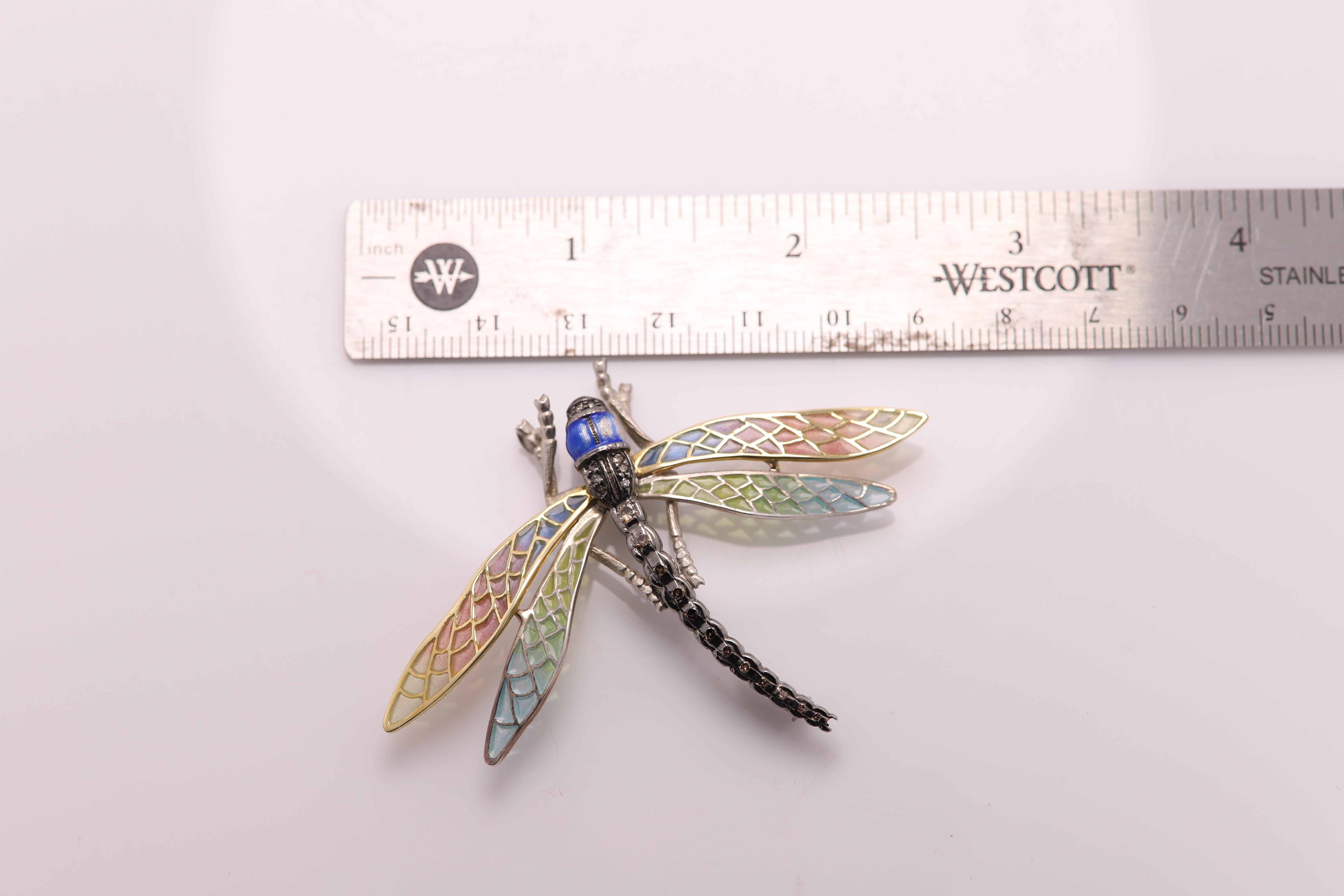 VINTAGE DRAGONFLY BROOCH PIN / NECKLACE
Hand made in Spain with brilliant colors of Enamel
Sterling Silver 925 (oxidized) and plus 18K Yellow Gold
Total weight 11 grams
Brown Diamonds all along the tail
Dimension: 2.75' inch wide. and about 2' inch