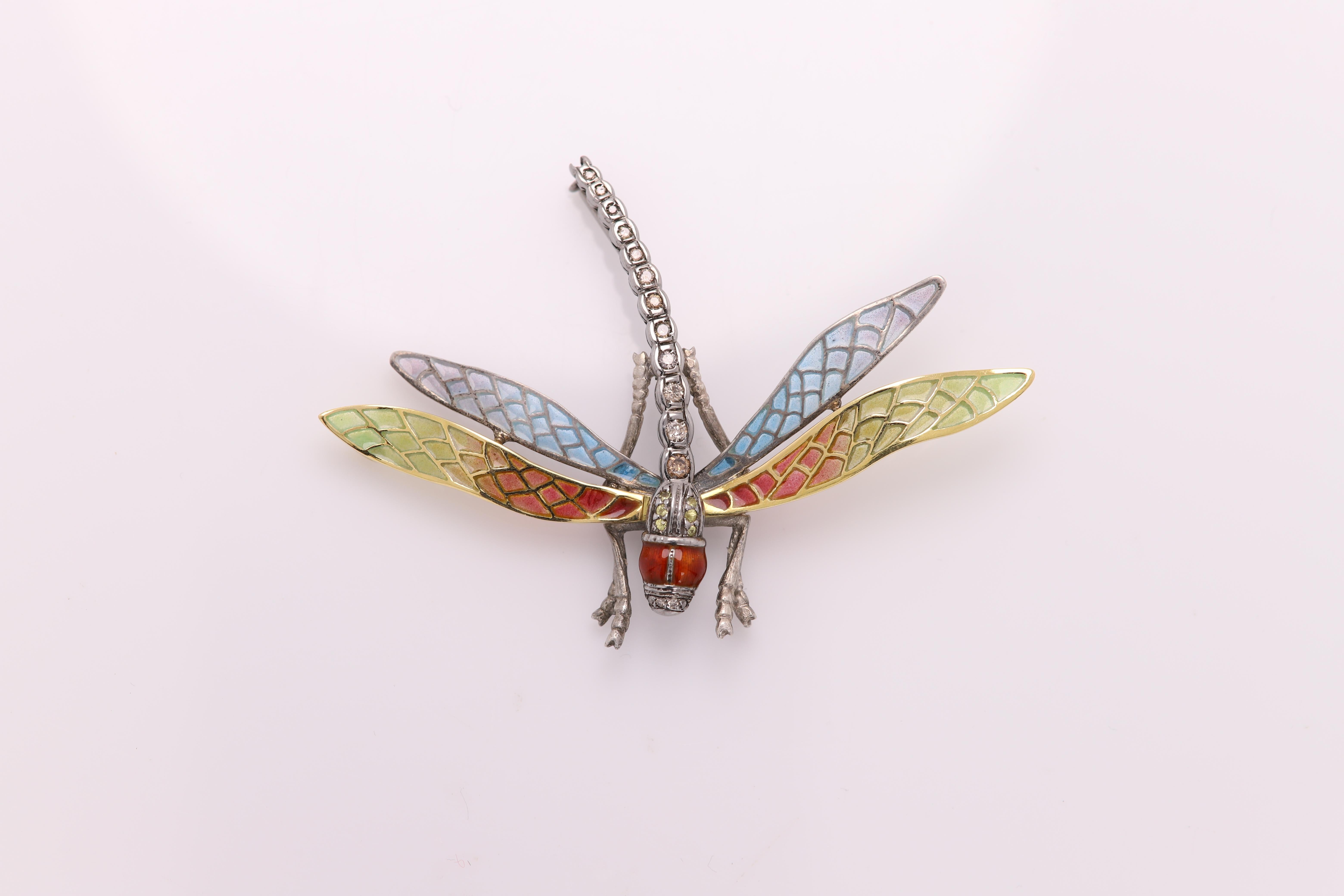 Magnificent VINTAGE DRAGONFLY BROOCH PIN / NECKLACE
Hand made in Spain with brilliant colors of Enamel
Sterling Silver 925 (oxidized) and 18K Yellow Gold
Total weight 11 grams
Brown Diamonds all along the tail + some yellow sapphires
Dimension: