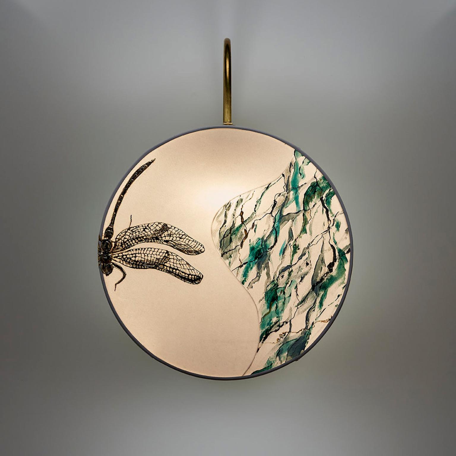 Dragonfly: Secret World collection. Inspired by the Chambers of treasures and rare objects of European history. The sconce composed of a small natural brass structure supporting the lampshade, consisting of two round disc in ivory velvet whit