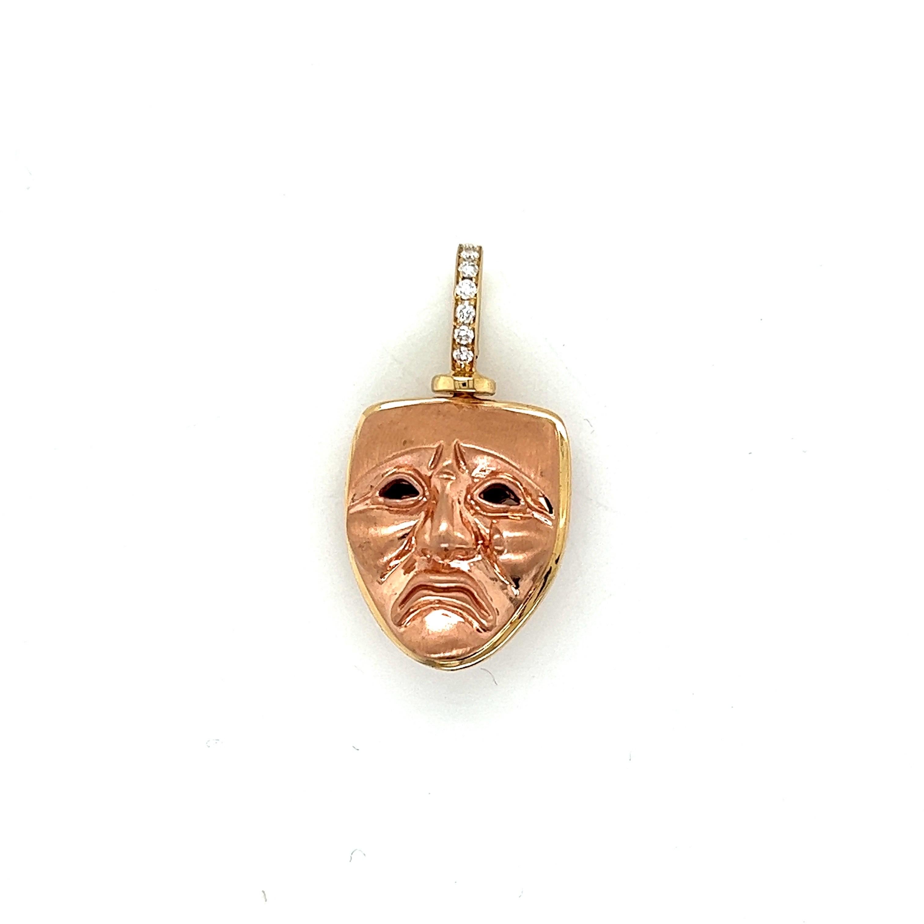 Drama/Tragedy/Comedy 14k rose and yellow gold pendant with swivel diamond bail. The faces are matte finish with highlights.
7 white diamonds in the bail.
The pin measurements (without bail): H: 19.25mm x W: 15.85mm x D: 11.90mm 
Total height with