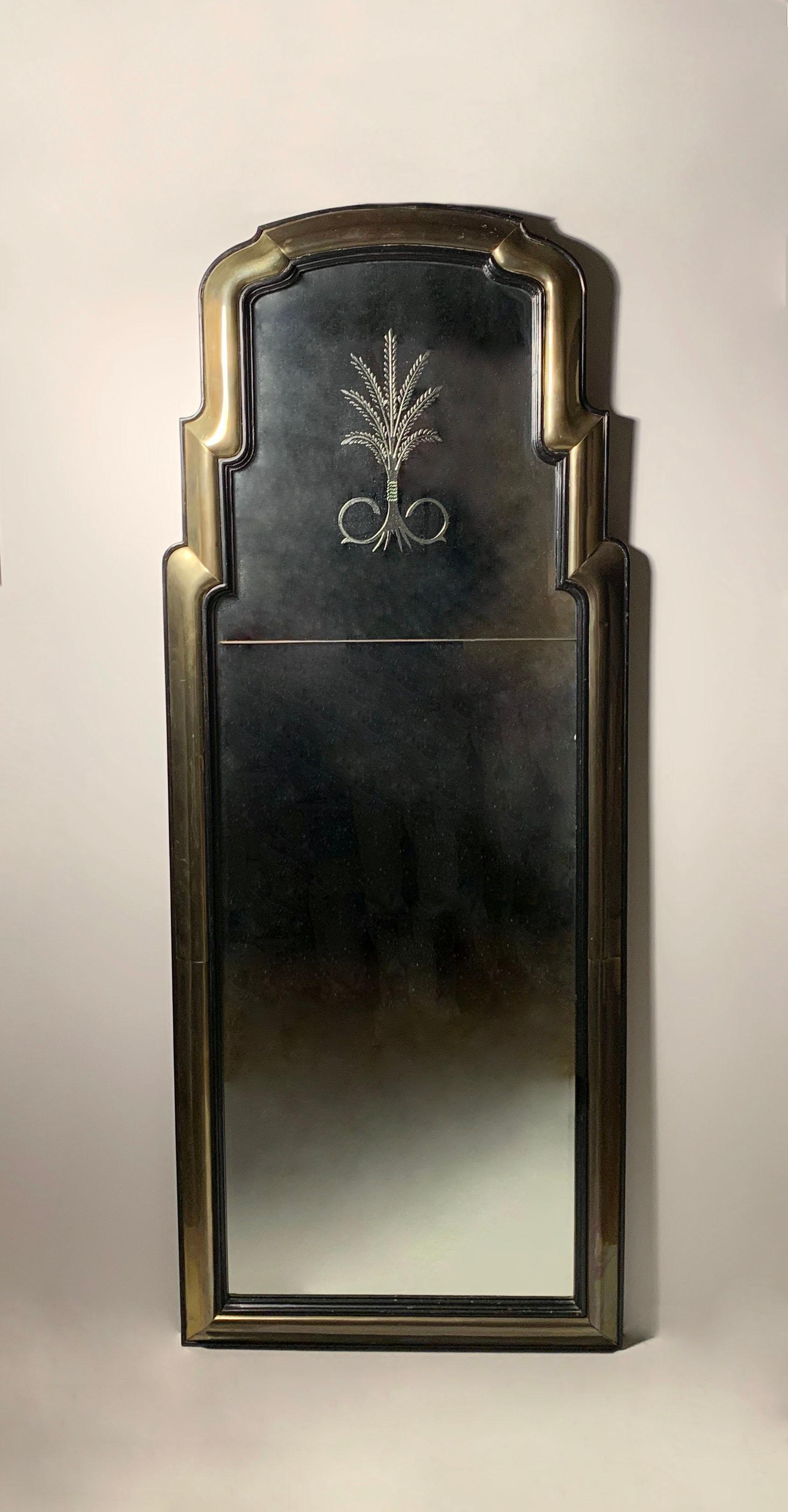 Dramatic Brass and Wood Waterfall Mirror with Etched Plume Design

Uncertain to origin of the mirror. Possibly from Italy or France. Possibly by Mastercraft.  No makers mark on reverse. High quality craftsmanship all around on this mirror.  Some