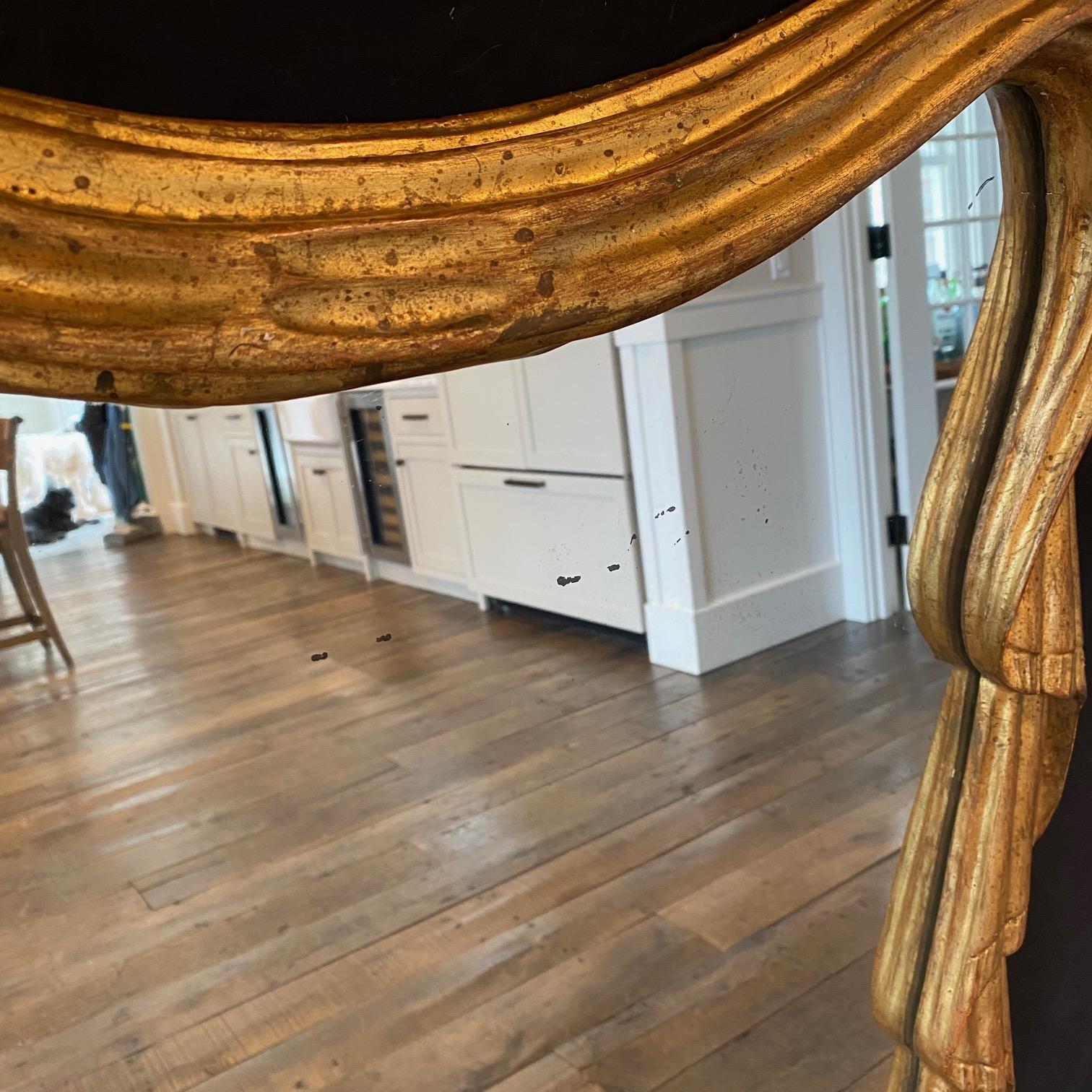 Stunning elegant French Art Nouveau gold gilt mirror in the form of draped curtains, with beautifully arched top and lovely tie knot in center bottom. Super rare: we have never seen a mirror like this - bought in France near Paris!
#8206