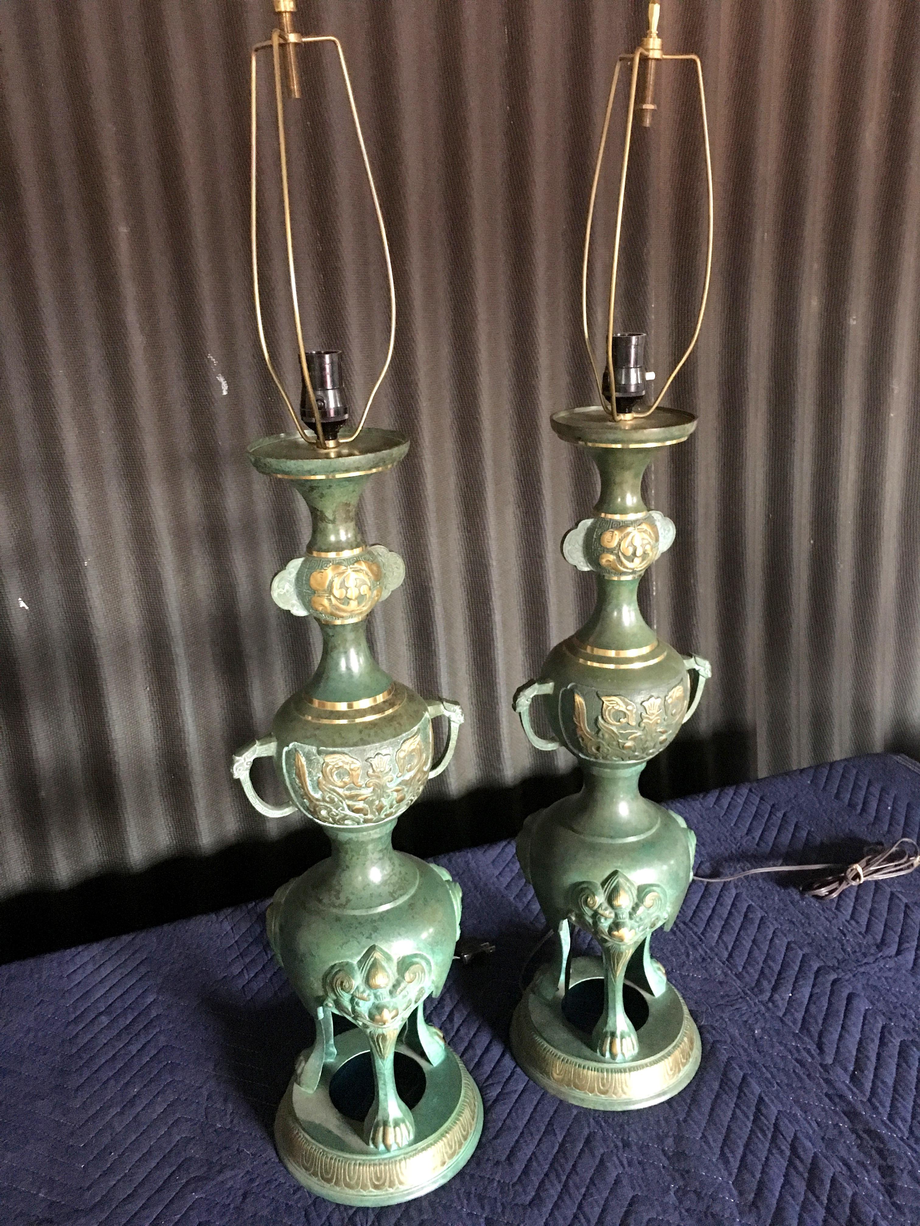 In the style of James Mont, these amazing lamps are just perfect!
Bronze lamps trimmed in brass. Simply gorgeous!
Lamps are in excellent condition with no visible signs of wear.
Wiring is perfect and the lamps are ready to use right