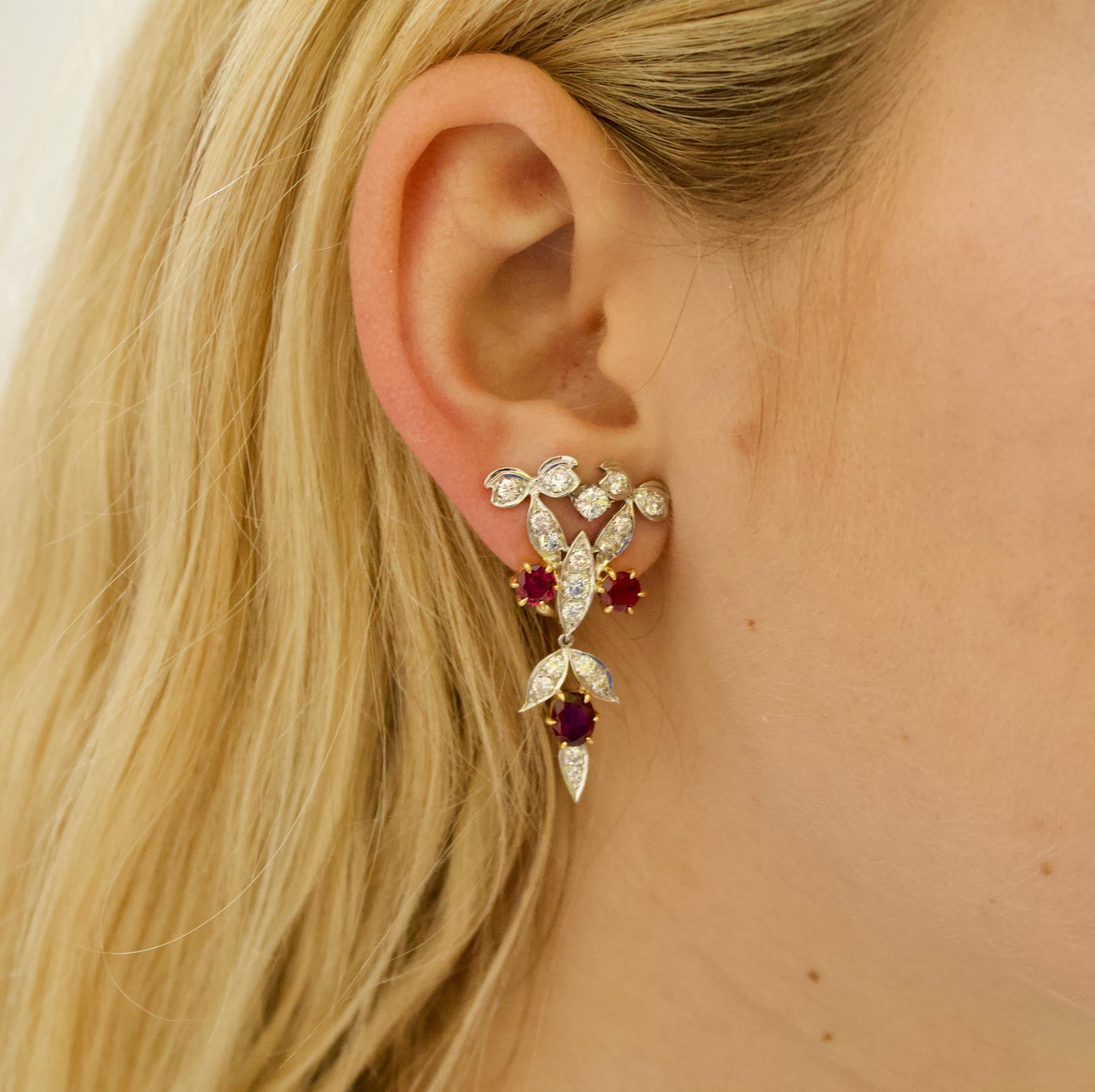 Dramatic Ruby and Diamond Dangling Earrings Circa 1940's in Platinum and 18k
Two Oval Rubies weighing 1.60 carats approximately
Four Oval Rubies weighing 1.40 carats approximately
Thirty Six Round Brilliant Cut Diamonds weighing 2.50 carats