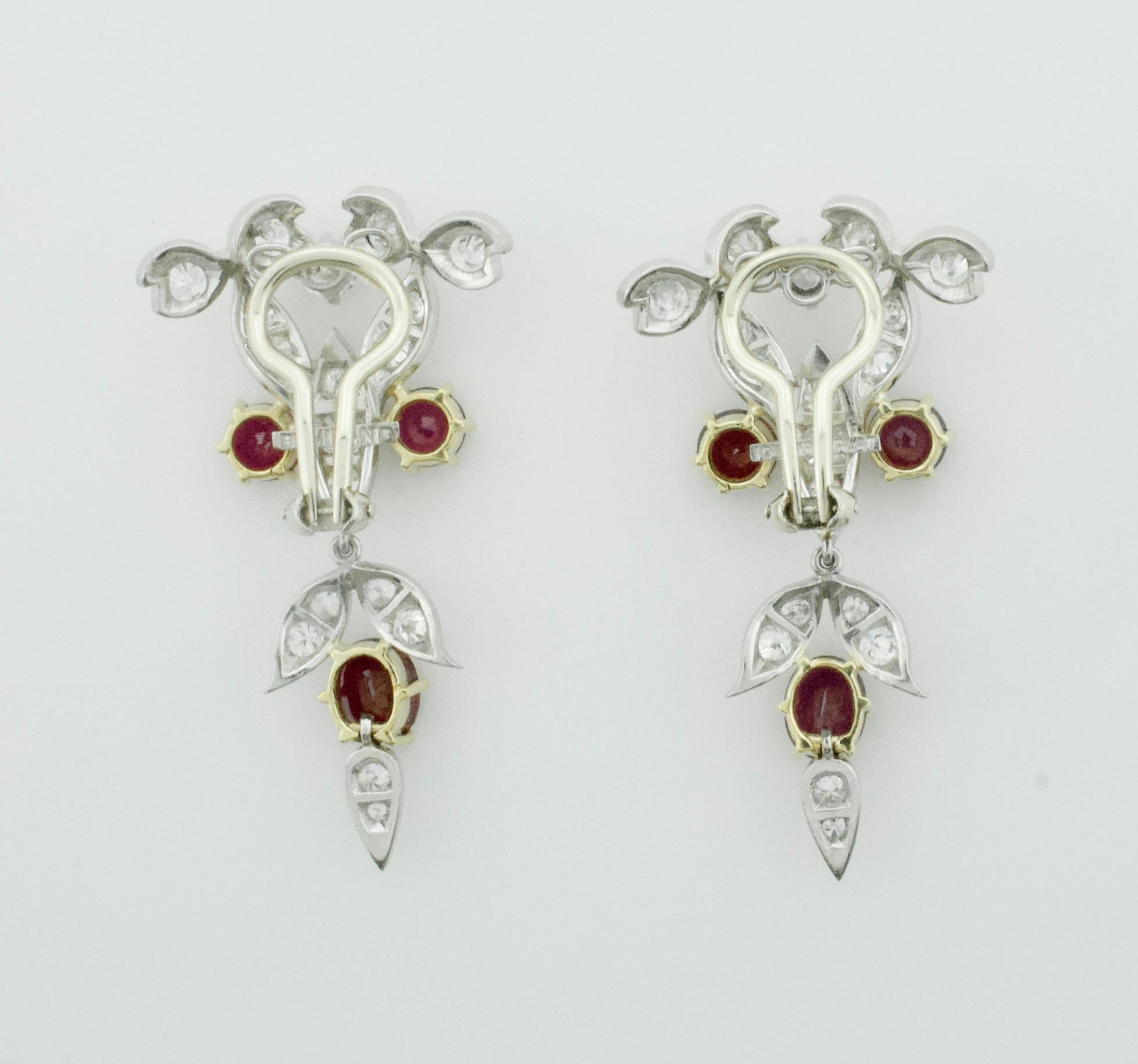 Oval Cut Dramatic Ruby and Diamond Dangling Earrings circa 1940s in Platinum and 18 Karat