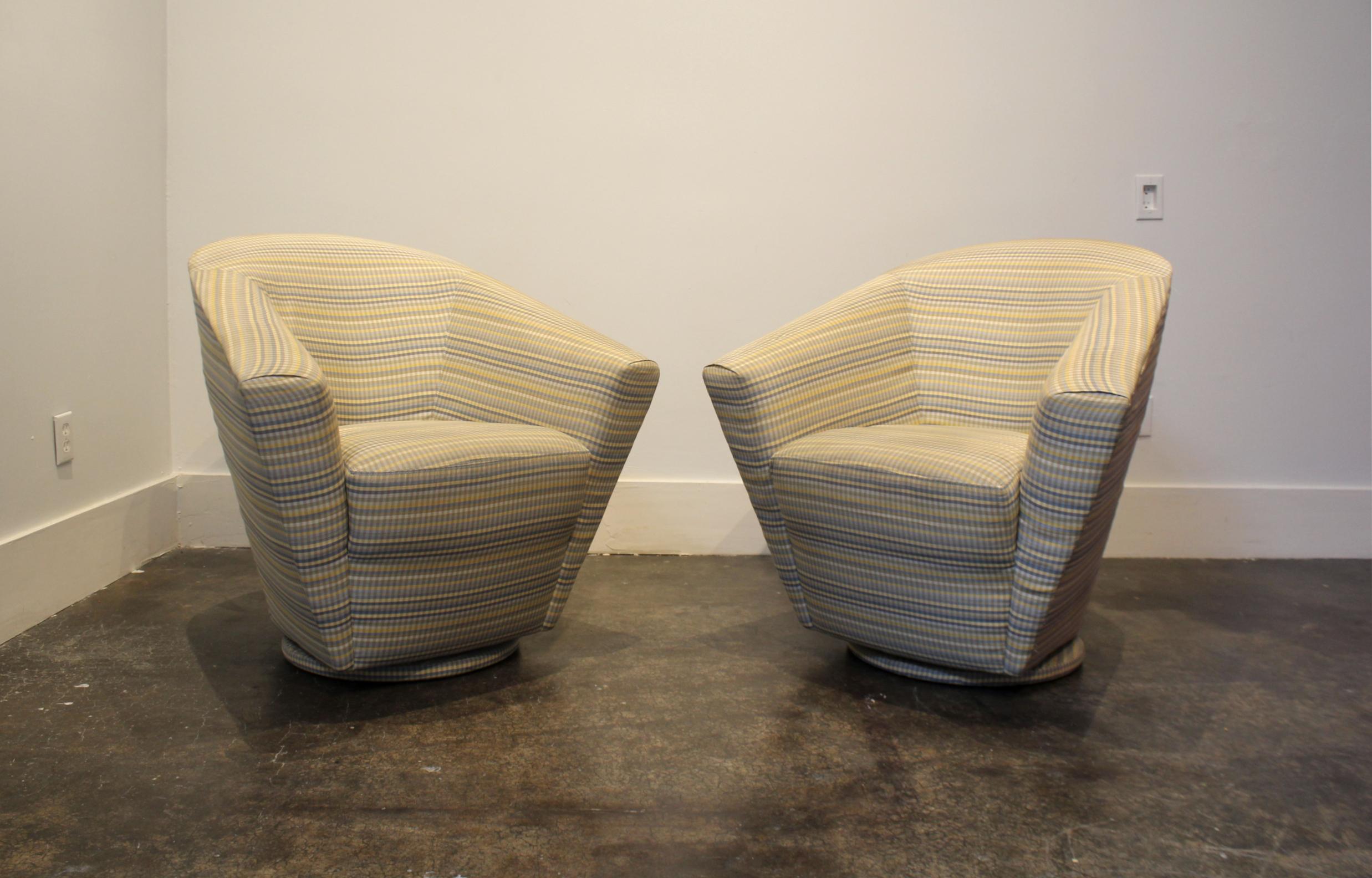 Very unique, designer swivel club chairs from the 1980s. Dramatic sculptural shape, upholstered top to bottom in original blue, grey and yellow gingham fabric. Light wear to fabric, one of the chairs has several stains (pictured).