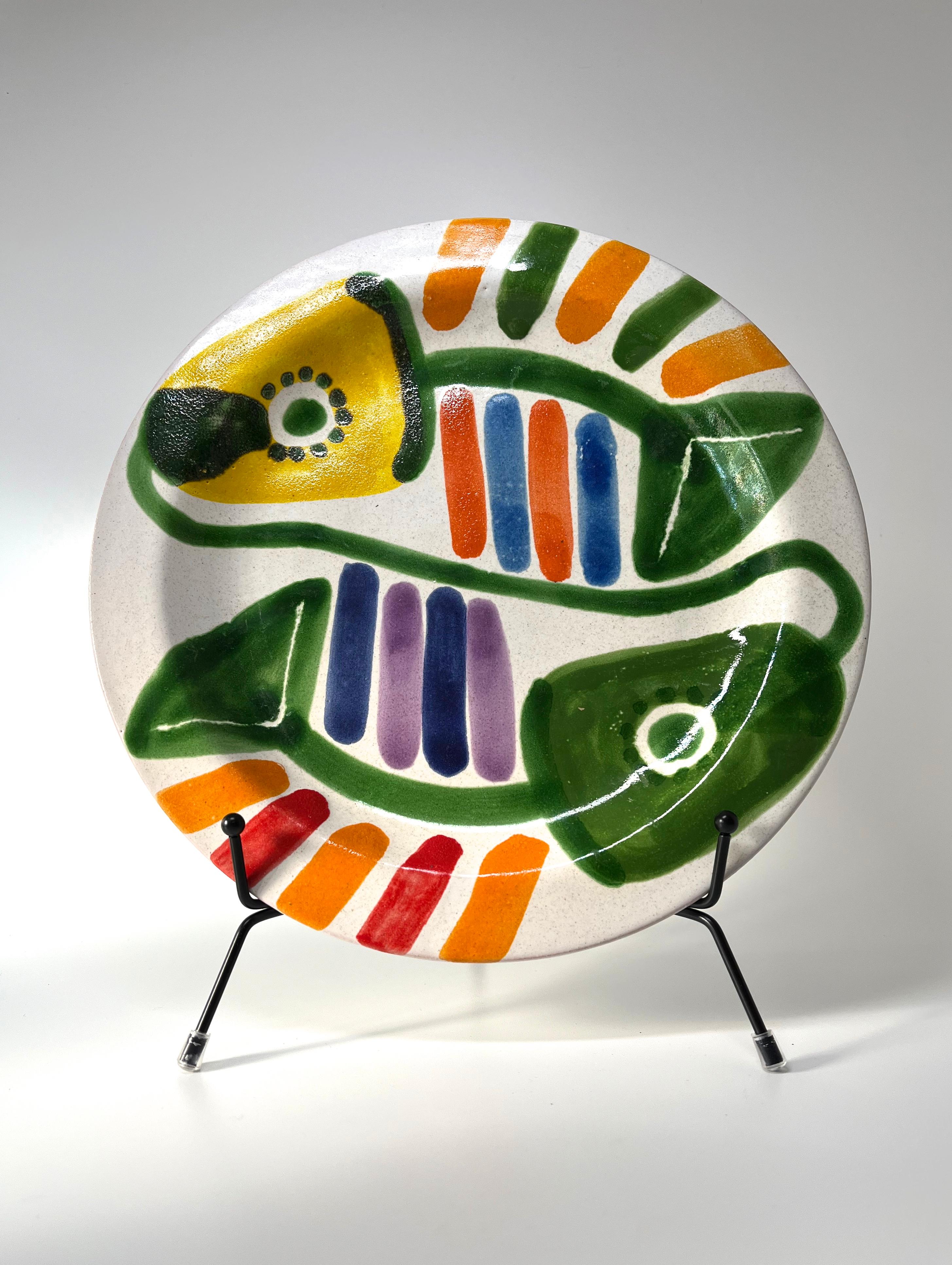 Bold and so colourful large mid-century ceramic plate by DeSimone, Italy
Hand painted Yin and Yang stylised fish dominate this entire piece
Circa 1960's
Signed DeSimone, Italy
Height 1 inch, Diameter 10 inch
In excellent condition
Wear consistent