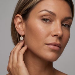 Boucles d'oreilles pendantes en or jaune 14 carats ornées d'un diamant de 0,55 ct