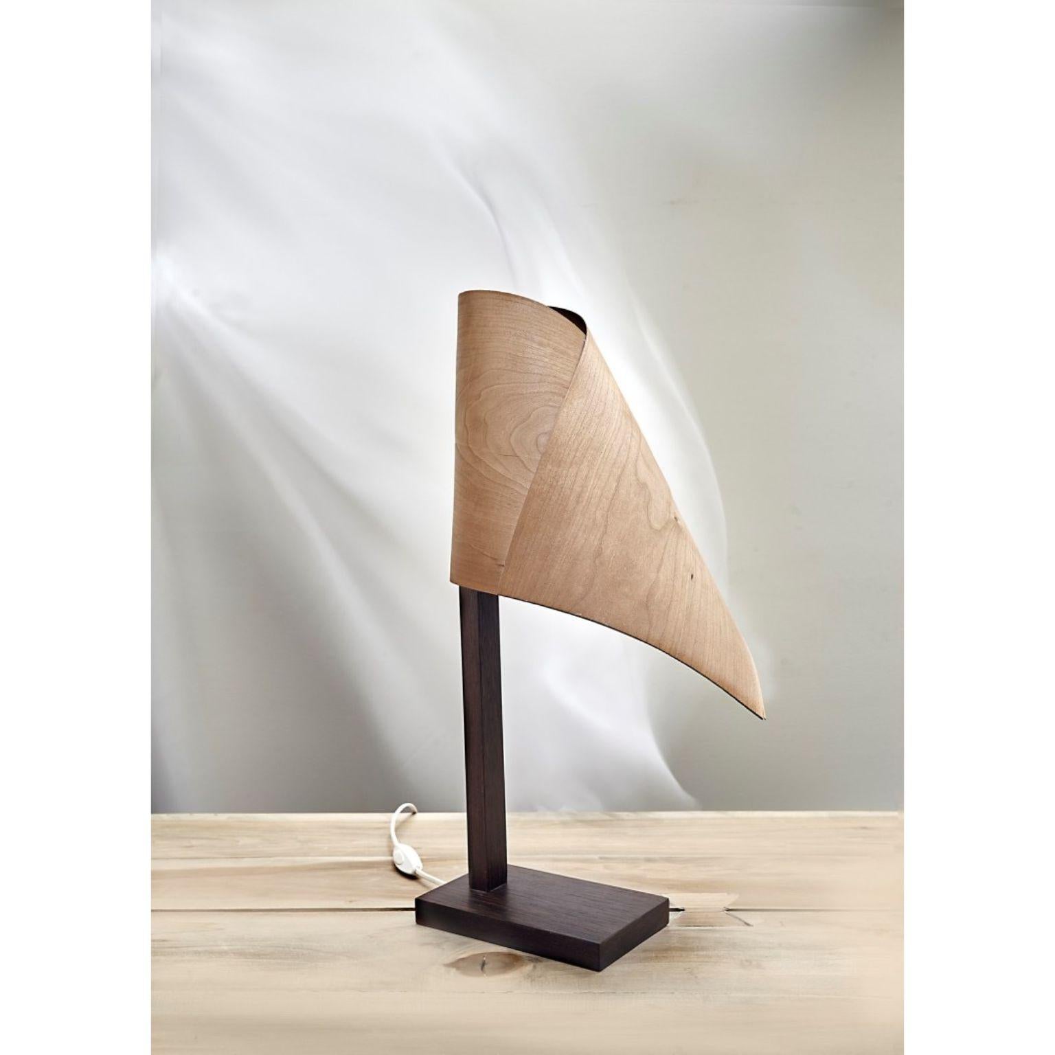 Drapé lamp by Jean-Baptiste Van den Heede
Signed, limited edition
Dimensions: 56cm high
Materials: Wenge wood, natural maple wood veneer


The Drapé table lamp is made of solid wenge wood with a shade of natural maple wood veneer.
A second