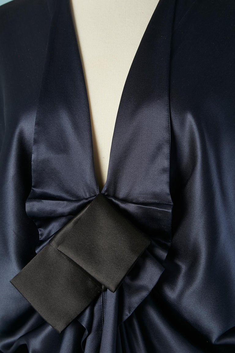 Drape silk navy blue cocktail dress with black satin bow. 
SIZE 38 (M) 