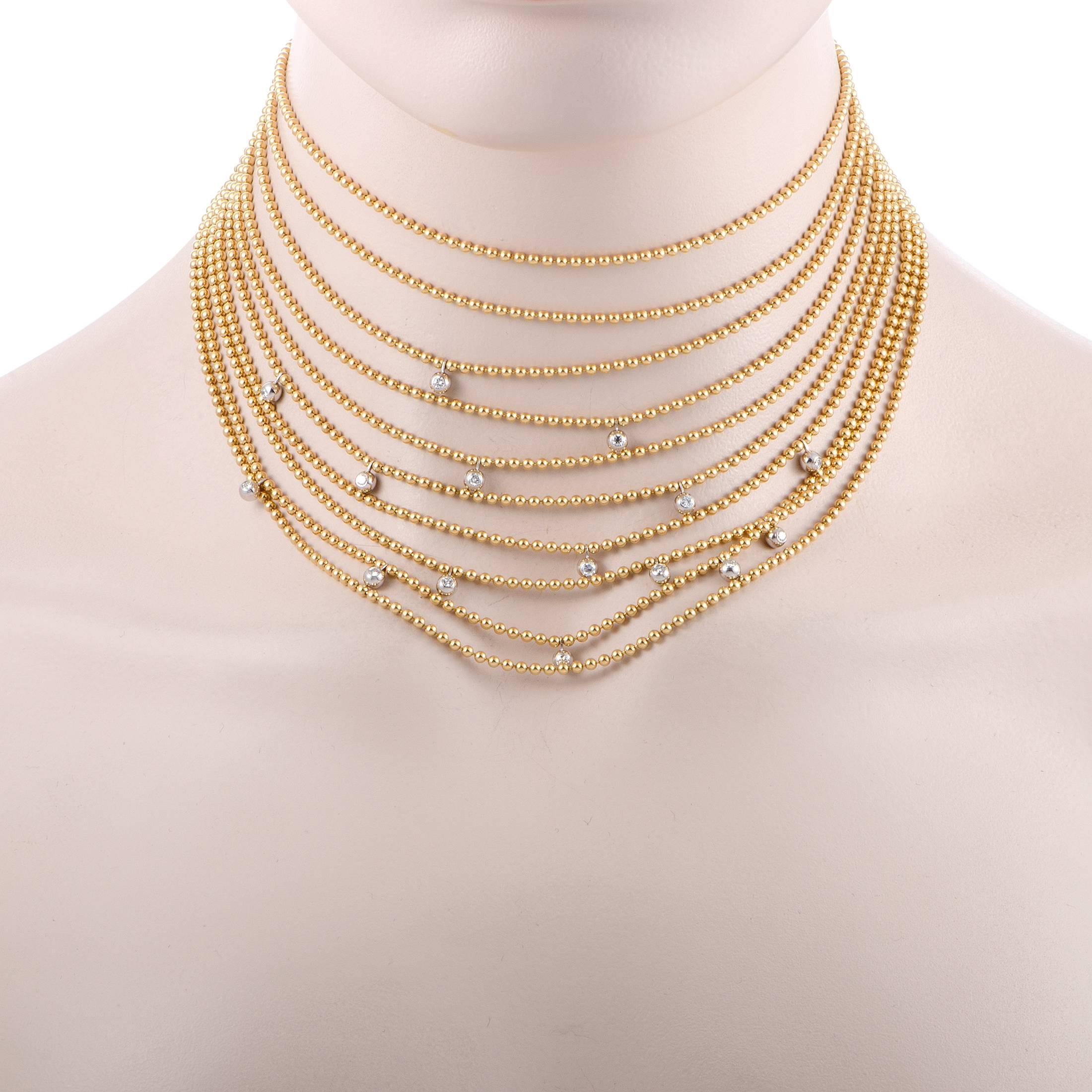 This incredibly luxurious necklace designed by Cartier is comprised of numerous beaded strings that create an exceptionally elegant appearance. The necklace is made of alluring 18K yellow gold, with its warm sheen accompanied by the cool glisten of