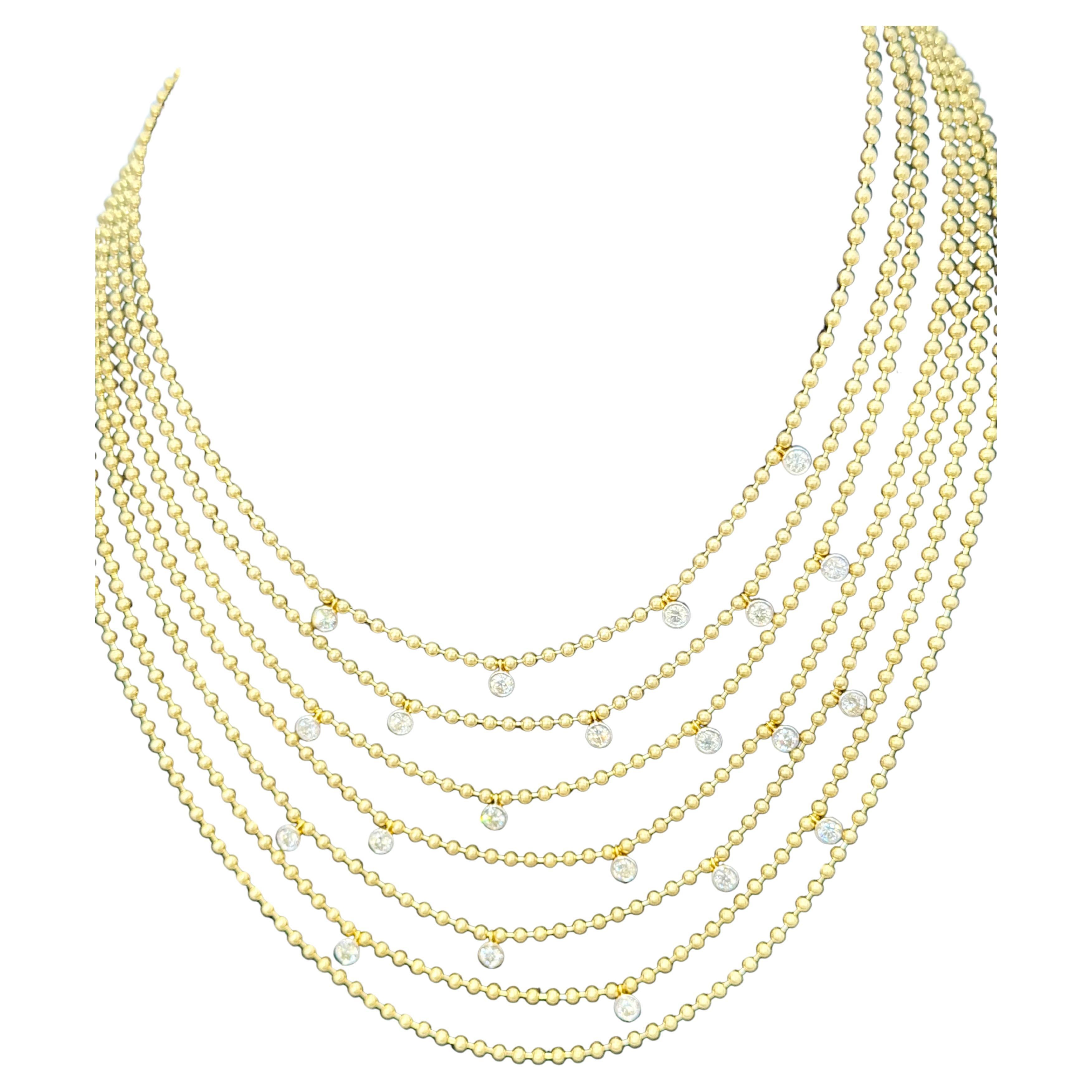 Découvrez le charme vintage de cet exquis collier Look Design/One en or jaune 18 carats de Cartier. Cette pièce étonnante présente un design distinctif à 7 couches, qui non seulement rehausse son élégance, mais offre également une grande polyvalence