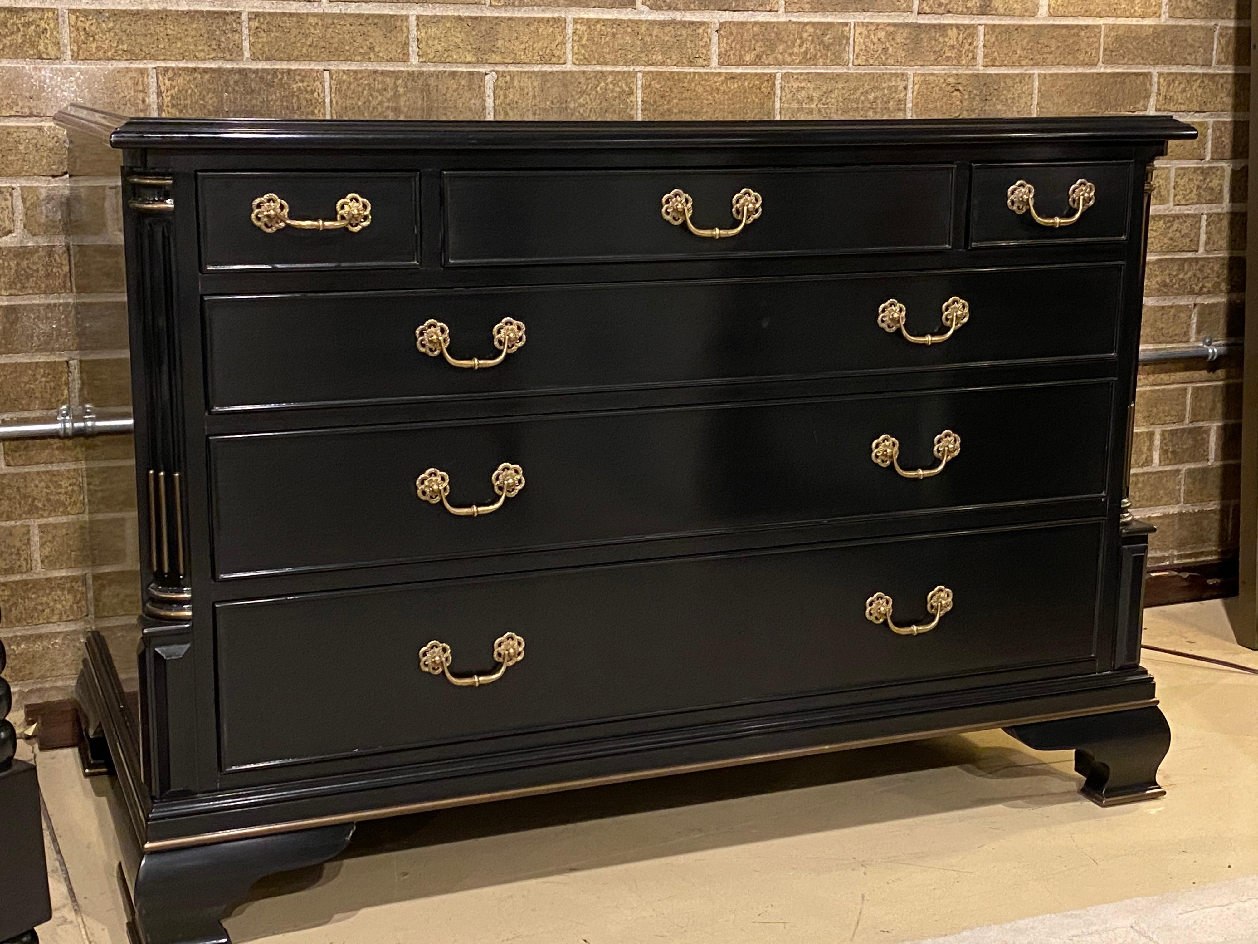 A low chest finished in black with gold accents. From the Ralph Lauren Collection by Century Furniture
This chest has six drawers, a bank of three draws across the top and three double drawers below.
Fluted corner pilasters.