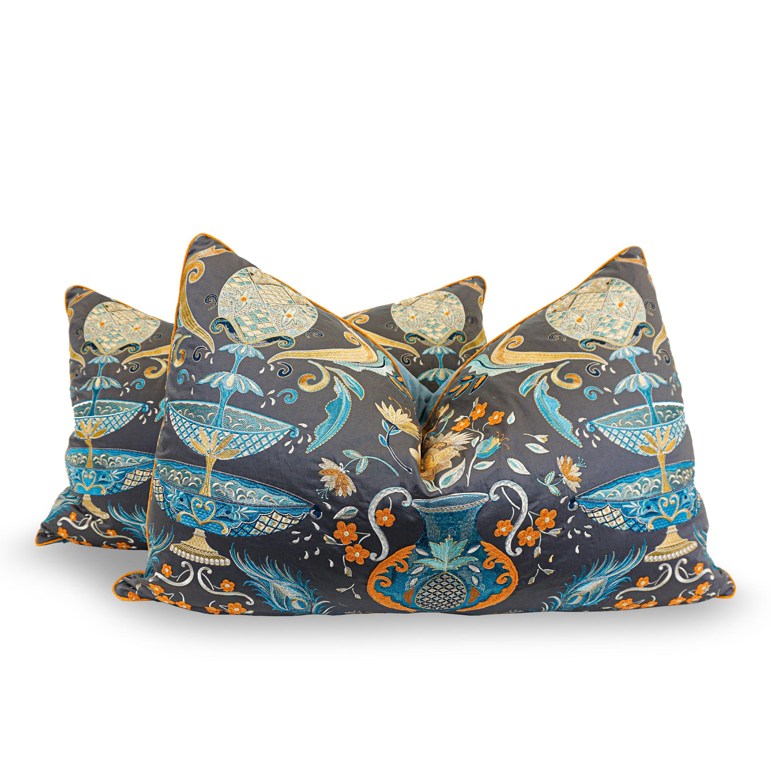 Oversize pillows are stuffed with a down/feather blend and covered with an exquisite embroidery design featuring an ornamental fountain and pineapple on a contrasting gray cotton satin ground. Fabric is designed by Matthew Williamson for Osborne and